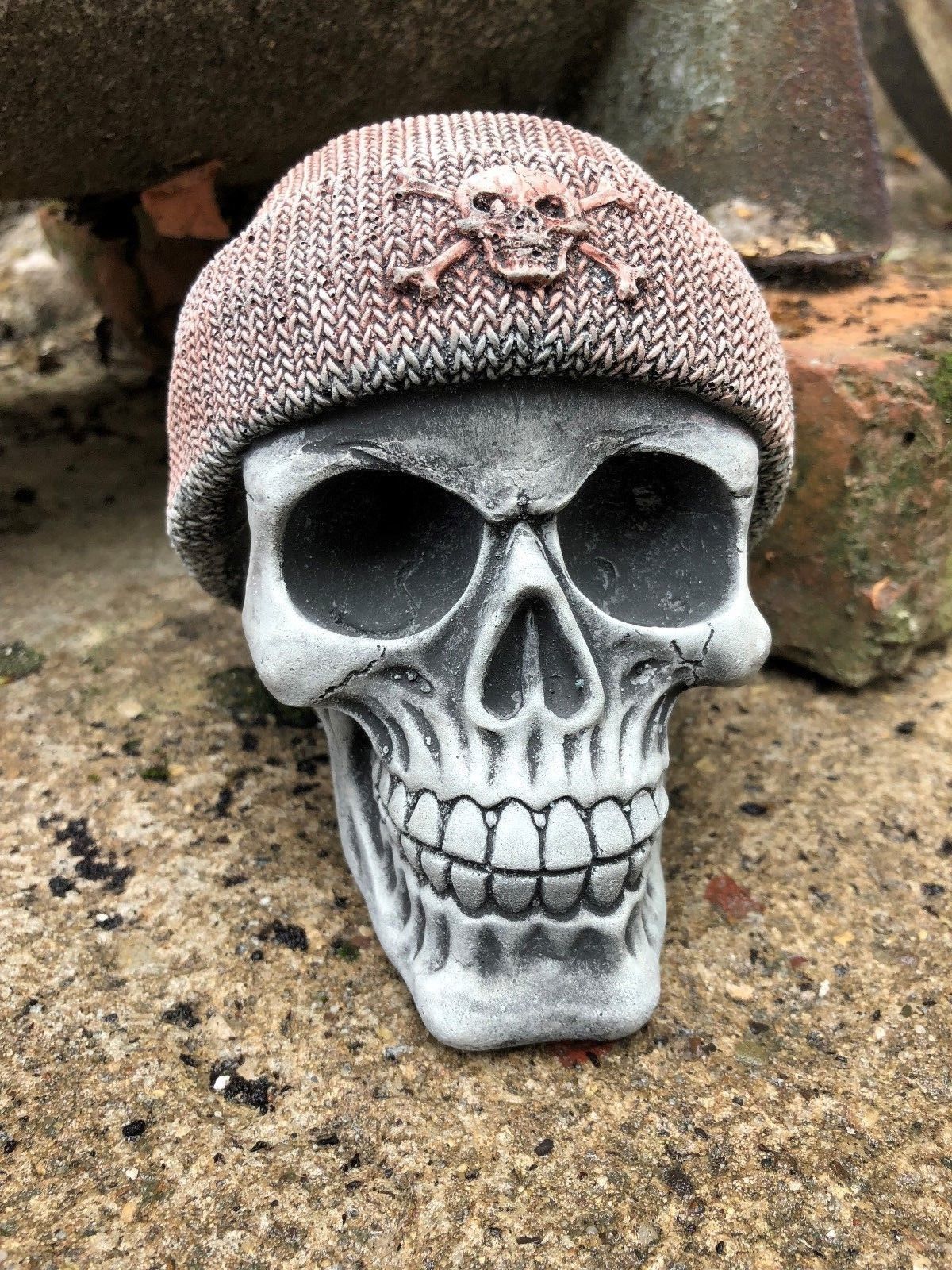 Front-facing Stone Skull Beanie Ornament with crack-resistant limestone build and detailed knit beanie, perfect for lawn or flowerbed decor.