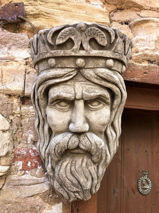 King Garden Planter - Stone Crown Planter mounted on rustic stone wall, featuring detailed bearded face and antique limestone finish.