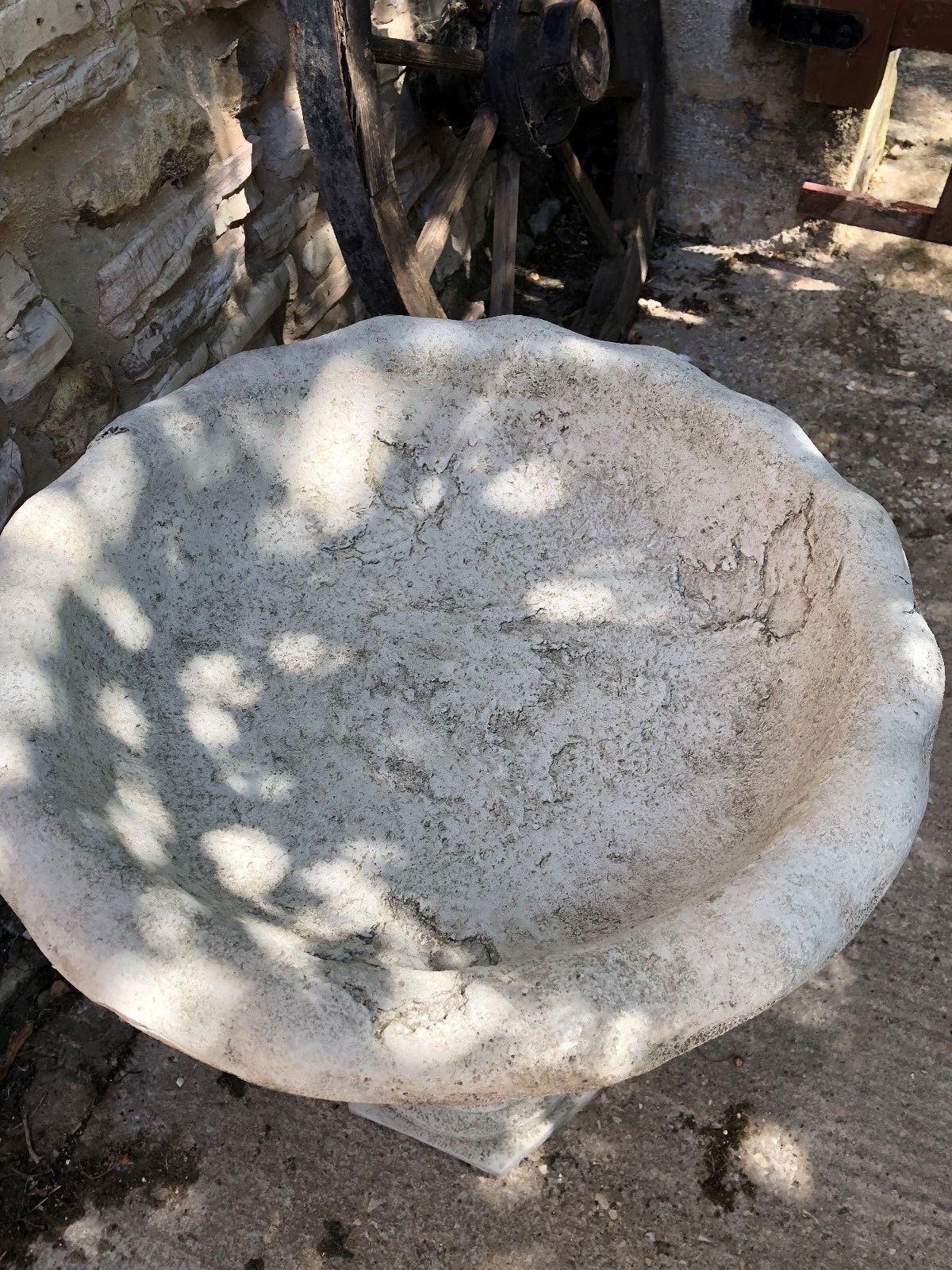 Top view of scalloped bowl on Leaf Design Garden Bird Bath, showing weathered stone surface and natural patina.
