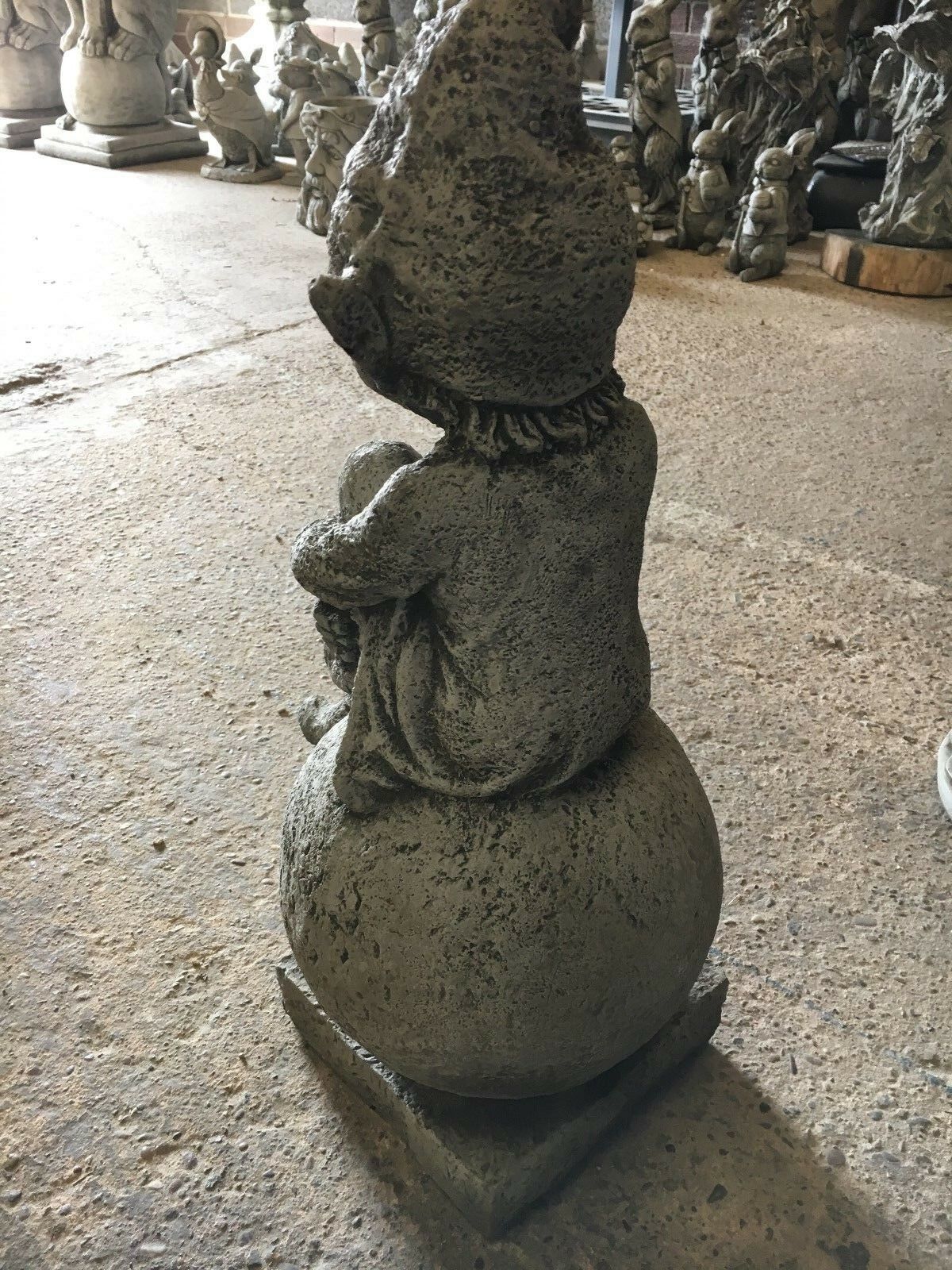 Stone Pixie on Ball Statue - Weatherproof Decor | Durable rear view of solid stone pixie sculpture, showcasing detailed craftsmanship and texture.