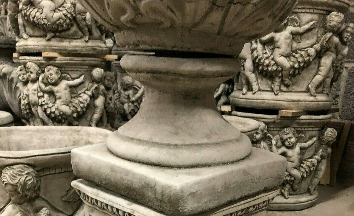 Close-up of the pedestal base of the Small Tulip Garden Planter, showcasing its detailed limestone texture and classic design.