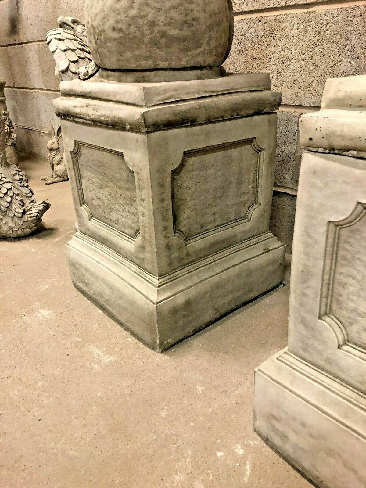 Close-up of the square limestone plinth base supporting the lion statues, showcasing fine craftsmanship and weather-resistant design.