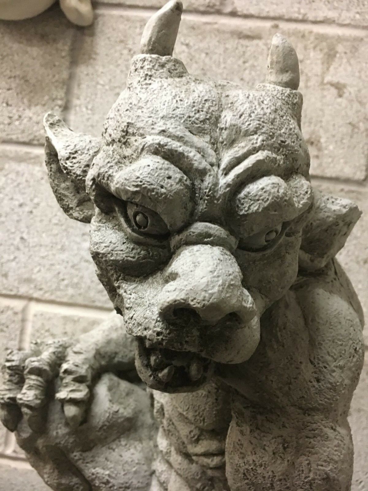 Angled view of stone gargoyle statue with clawed hands and fierce expression, perfect for guarding garden entrances or patios.