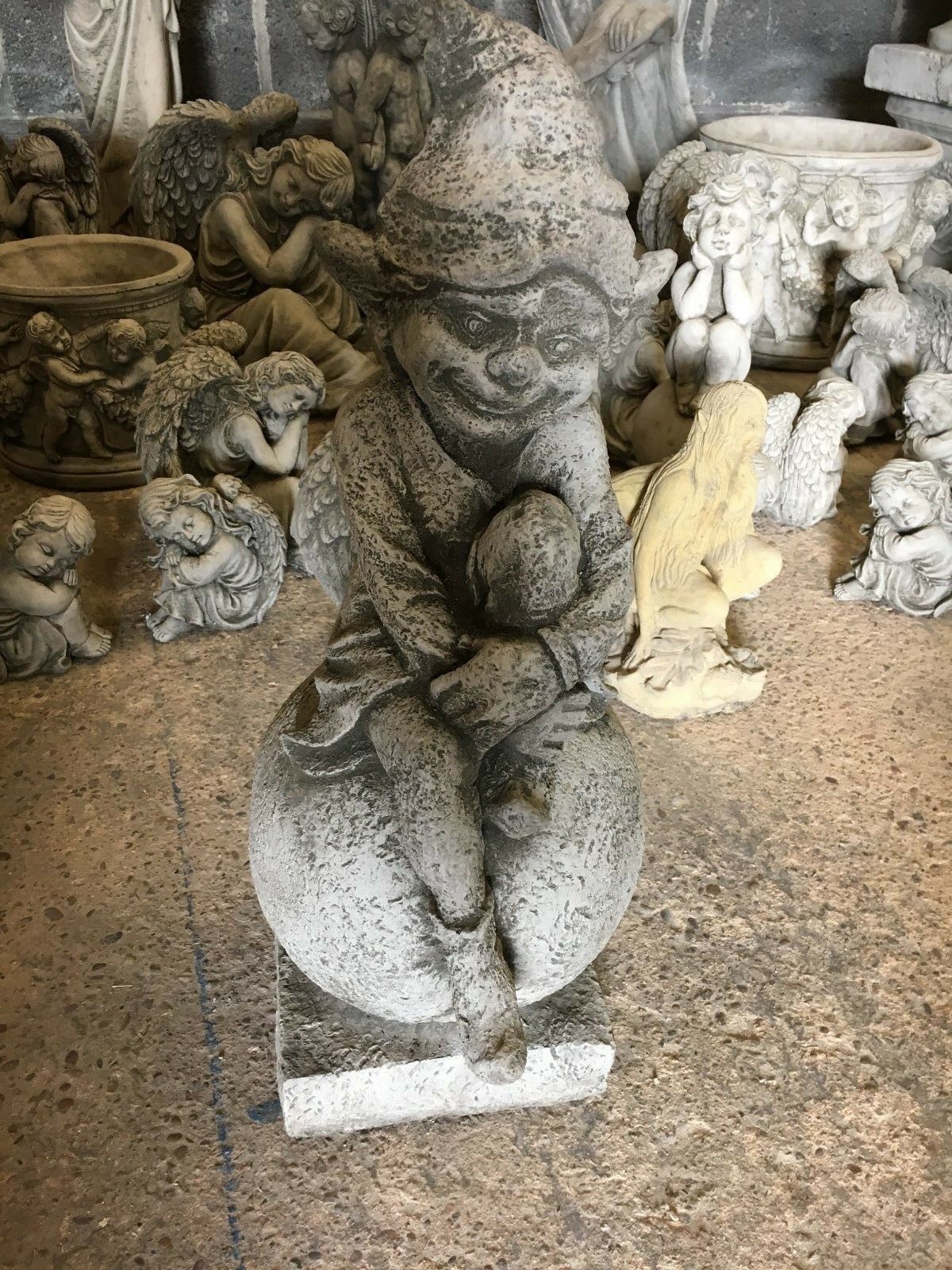 Stone Pixie on Ball Statue - Weatherproof Decor | Durable front view of garden pixie statue with antique finish, ideal for UK outdoor decor.