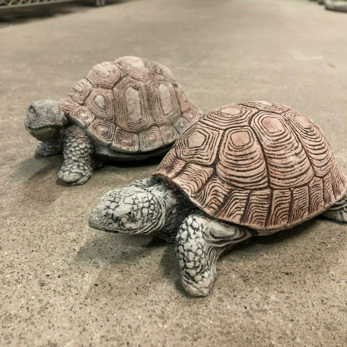 Stone tortoise garden decor set featuring two detailed animal sculptures with textured shells, perfect for patios, flowerbeds, or lawn accents.