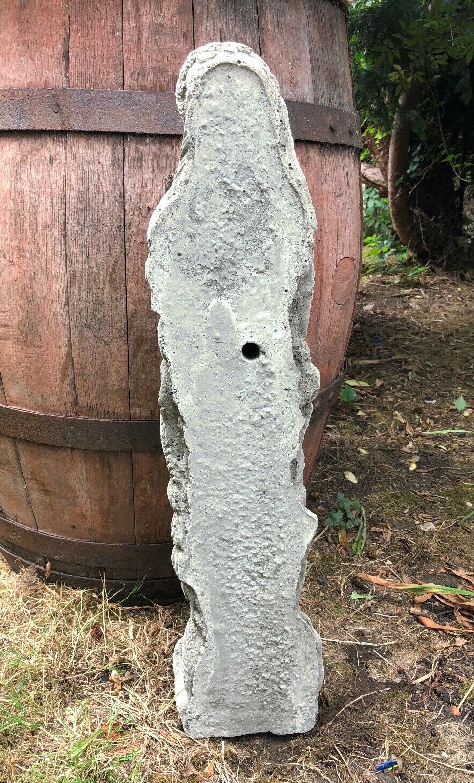 Back view of Mermaid Water Feature Ornament showing raw stone texture and water inlet hole for fountain installation.
