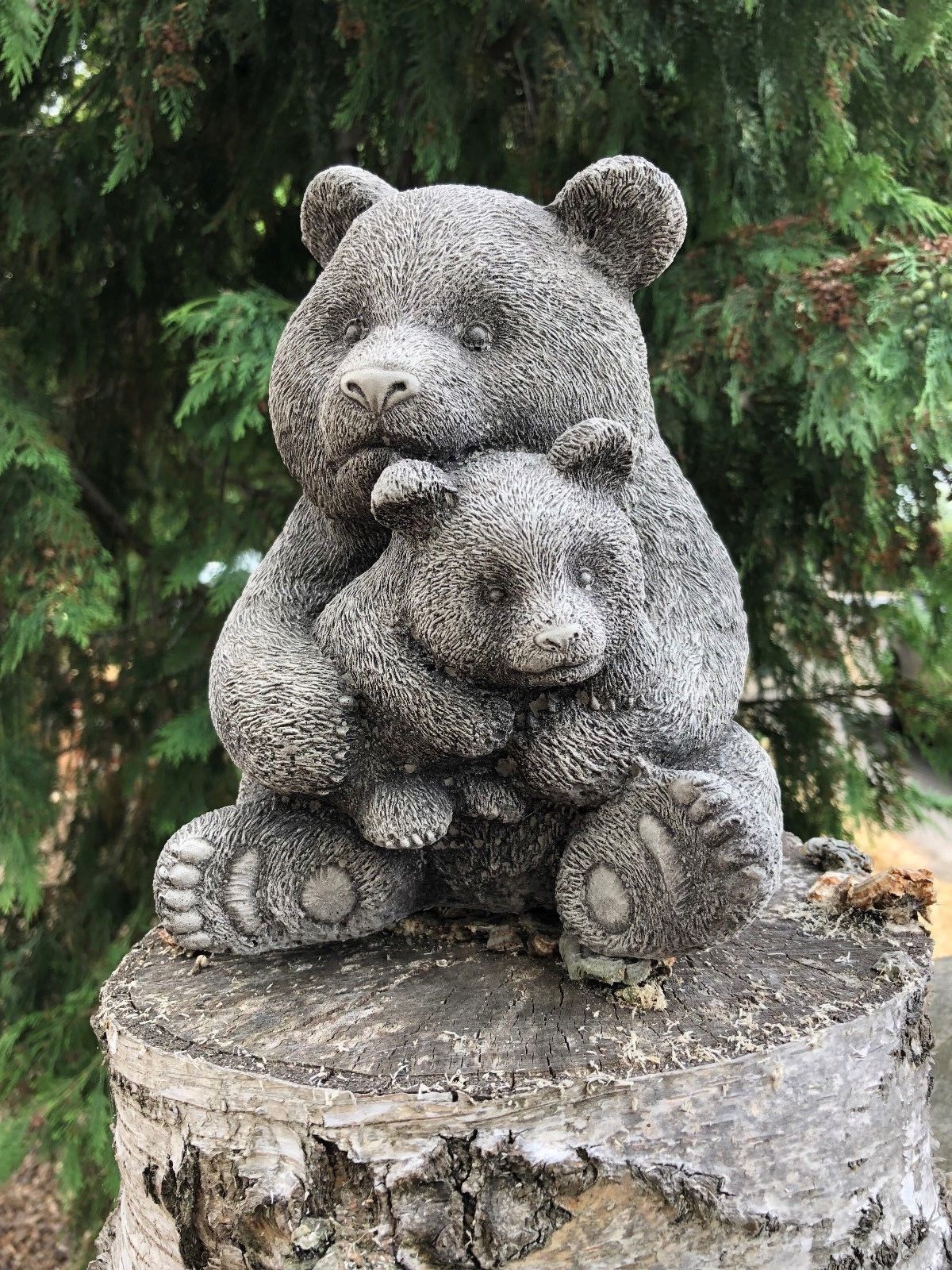 Mother & Baby Panda Sculpture - Stone Garden Ornament featuring a cuddling bear duo on a tree stump, ideal for outdoor garden decor.