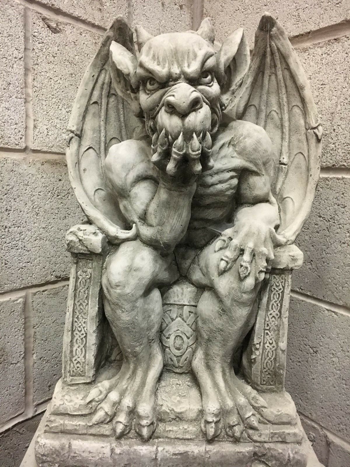 King Gargoyle Stone Statue - Weather Resistant Garden Art featuring a muscular gargoyle seated on a throne with intricate detailing, ideal for outdoor decor.