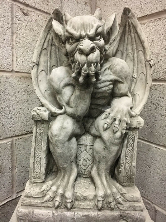 King Gargoyle Stone Statue - Weather Resistant Garden Art featuring a muscular gargoyle seated on a throne with intricate detailing, ideal for outdoor decor.