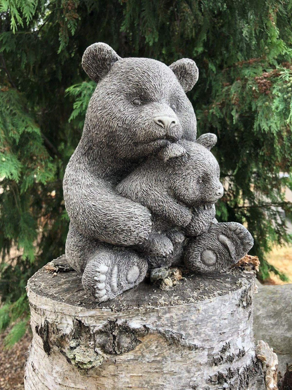 Detailed limestone Mother & Baby Panda Sculpture for garden use, showcasing a cute bear pair in a hugging pose on a natural wood base.