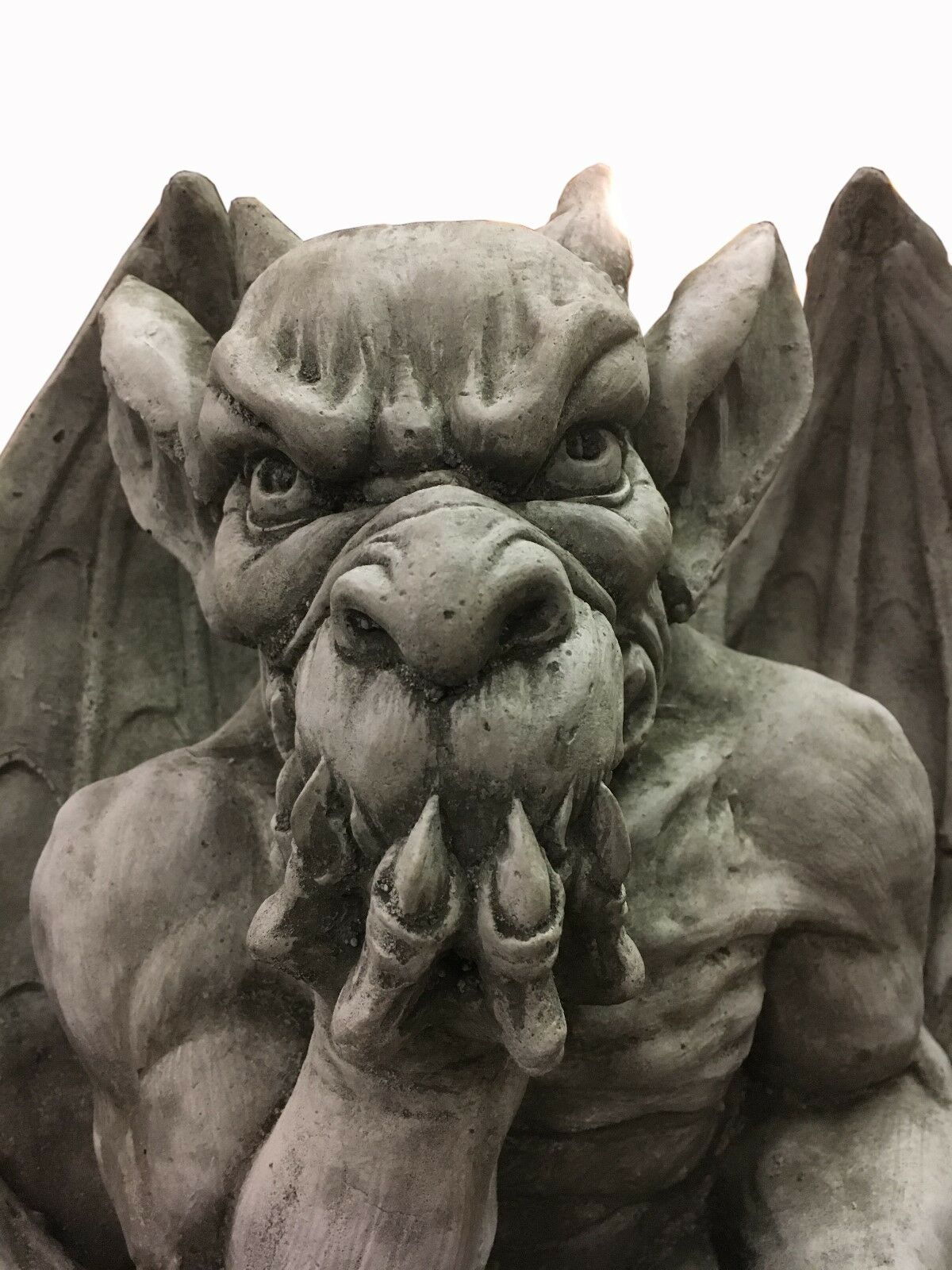 Close-up of King Gargoyle Stone Statue - Weather Resistant Garden Art showing fierce facial expression and detailed craftsmanship for garden sculpture lovers.