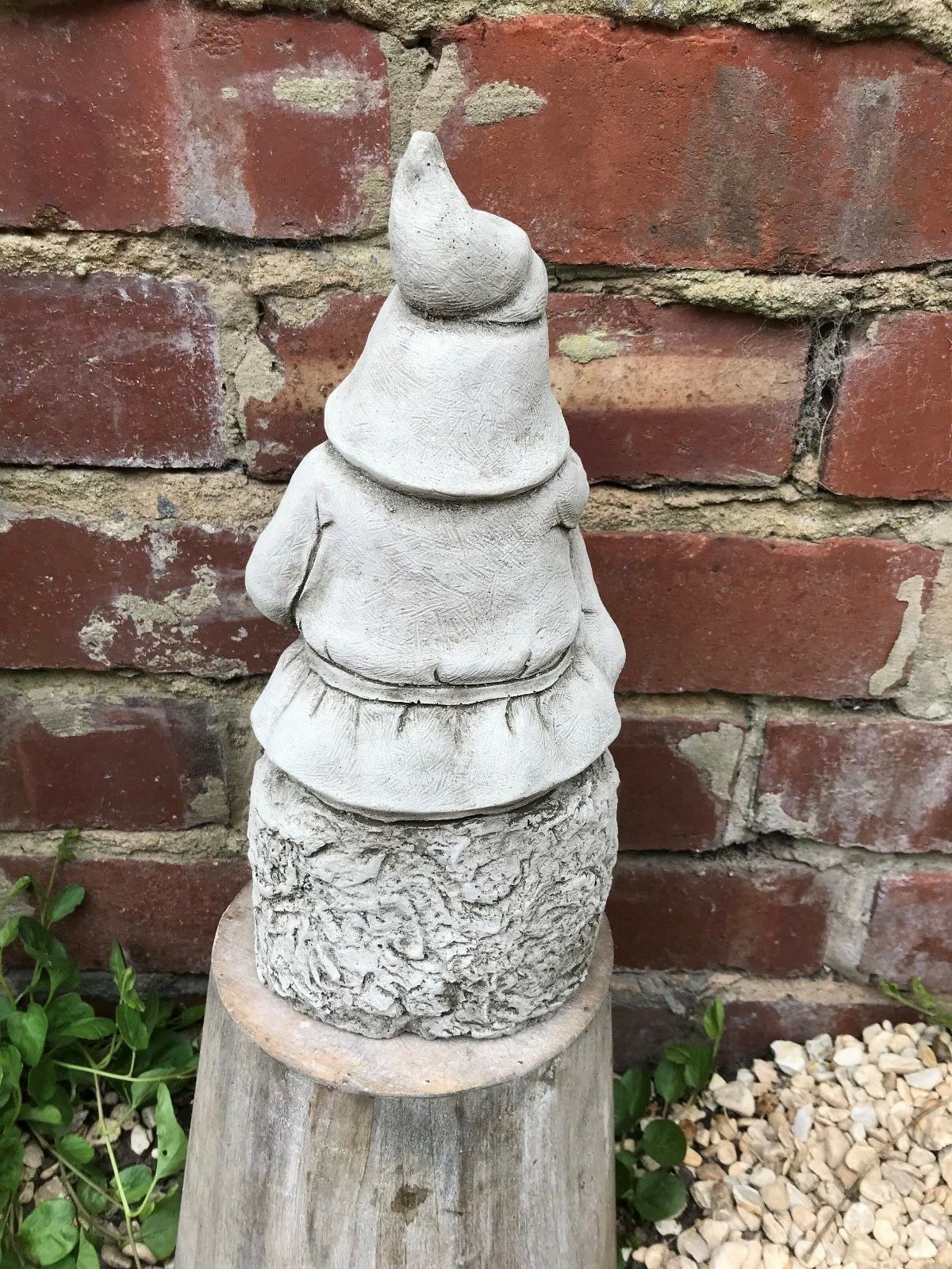 Back view of weatherproof Stone Searching Gnome Ornament showing detailed cloak and hat, crafted for outdoor garden use.