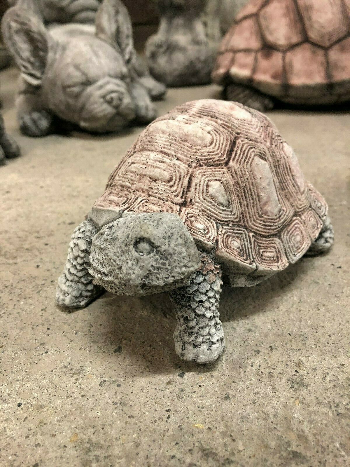 Close-up of one stone tortoise ornament with textured shell and lifelike features, crafted for long-lasting garden or patio decoration.