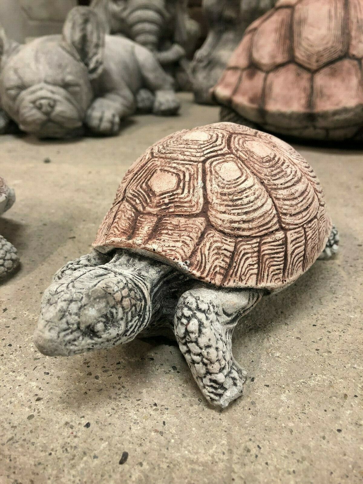Detailed view of second stone tortoise ornament with antique finish, part of a durable garden sculpture pair for outdoor decor.