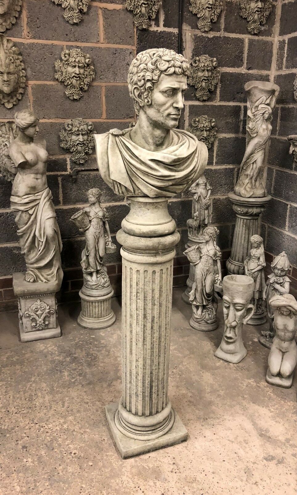 Full view of Stone Marc Anthony Bust Statue mounted on fluted Roman column, perfect for outdoor garden ornamentation in limestone finish.