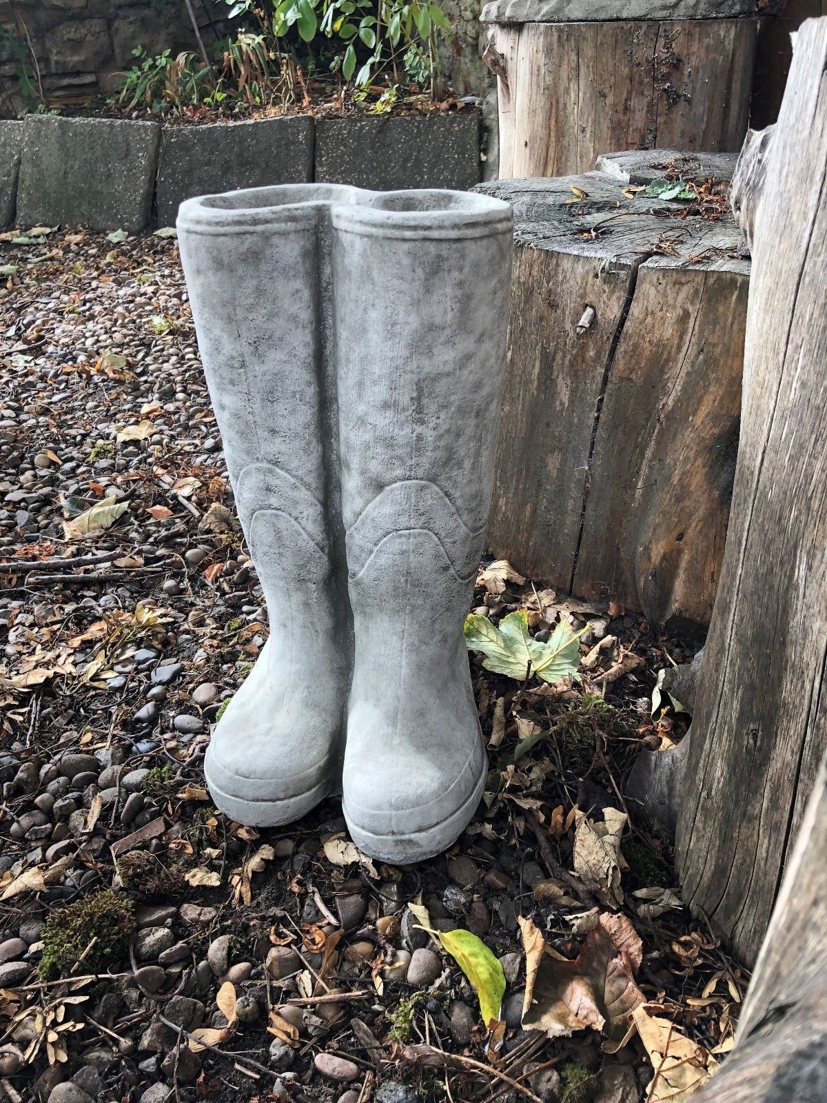 Weather-resistant Stone Wellington Boots Planter with antique finish, perfect for patios or garden paths with rustic outdoor charm.