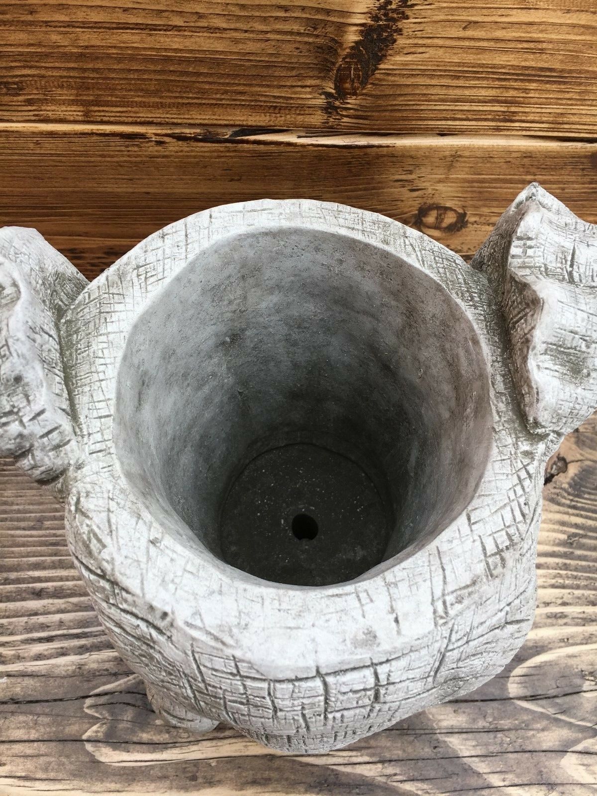 Top view of Stone Elephant Planter with visible drainage hole, designed for outdoor use and optimal plant health in garden settings.