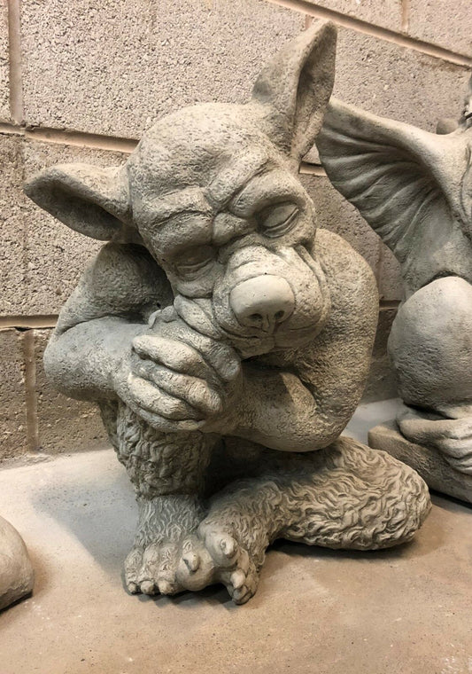 Sleeping Dog Gargoyle Statue in stone with detailed fur texture and closed eyes, ideal for gothic garden decor or outdoor ornament display.
