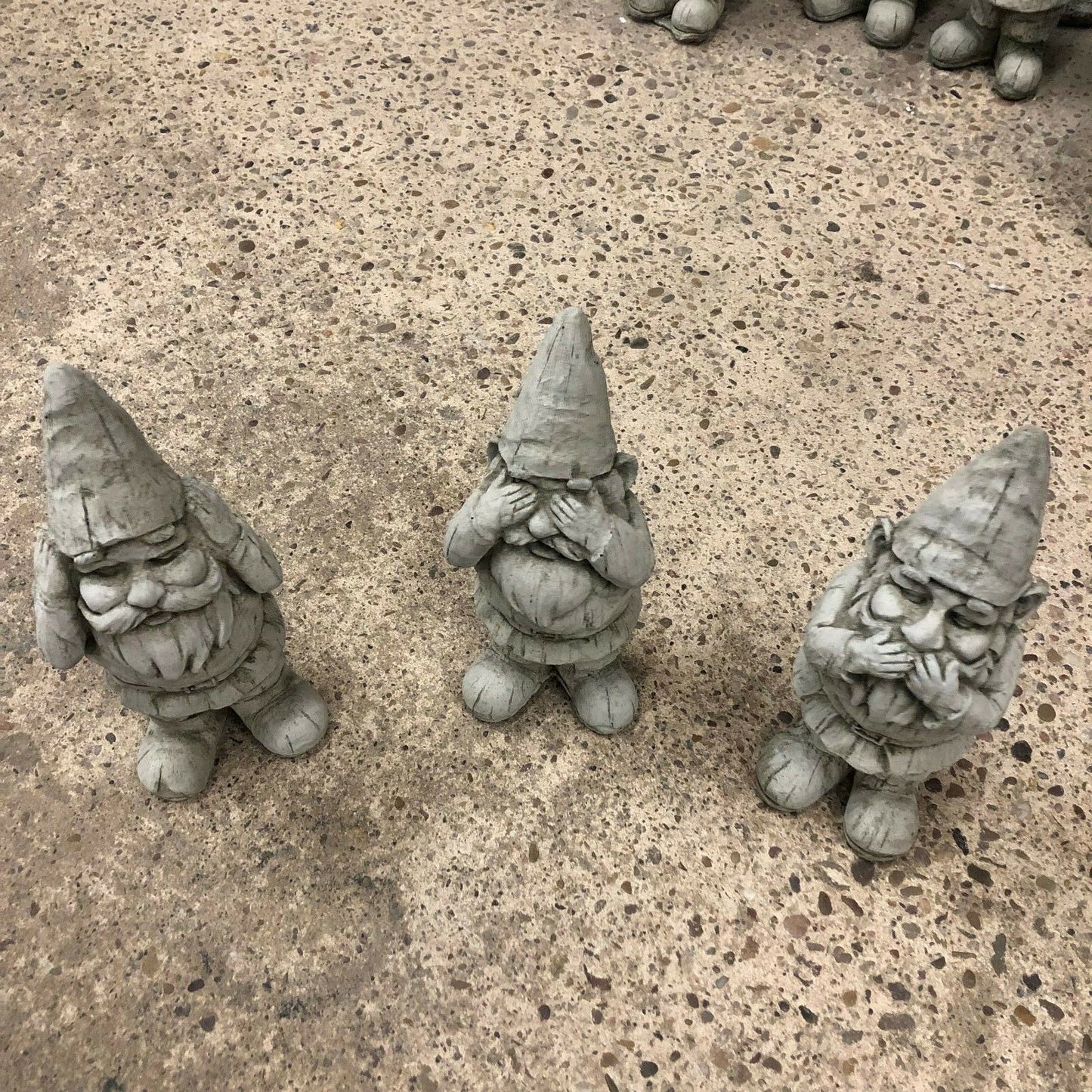 Top view of Stone Hear See Speak No Evil Gnome Statues Set showing detailed facial expressions. Perfect for flowerbeds or patio decoration.