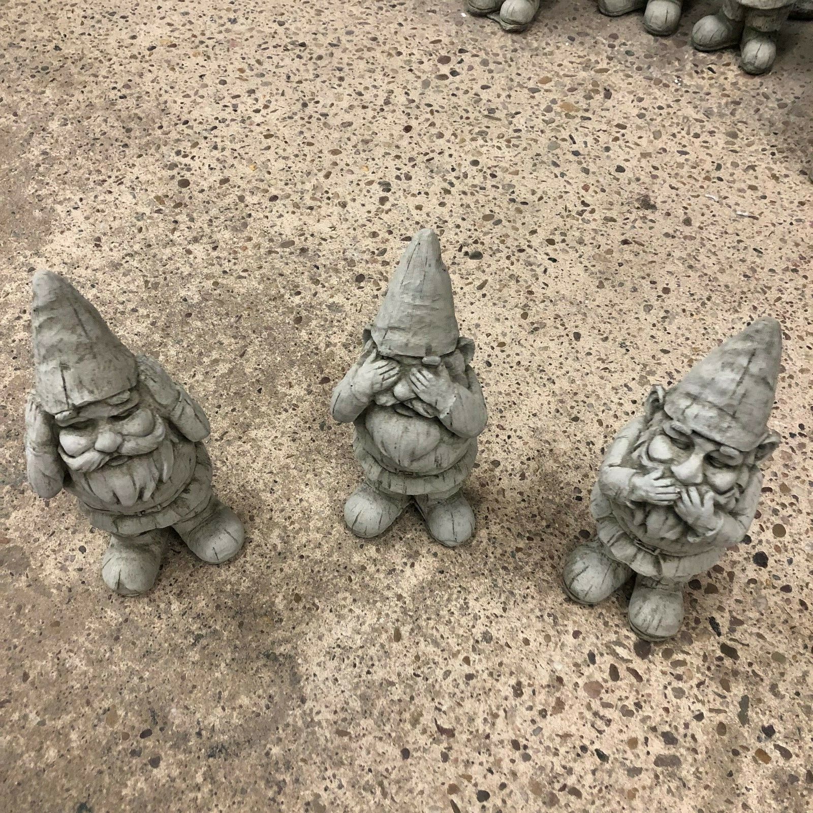 Top view of Stone Hear See Speak No Evil Gnome Statues Set showing detailed facial expressions. Perfect for flowerbeds or patio decoration.
