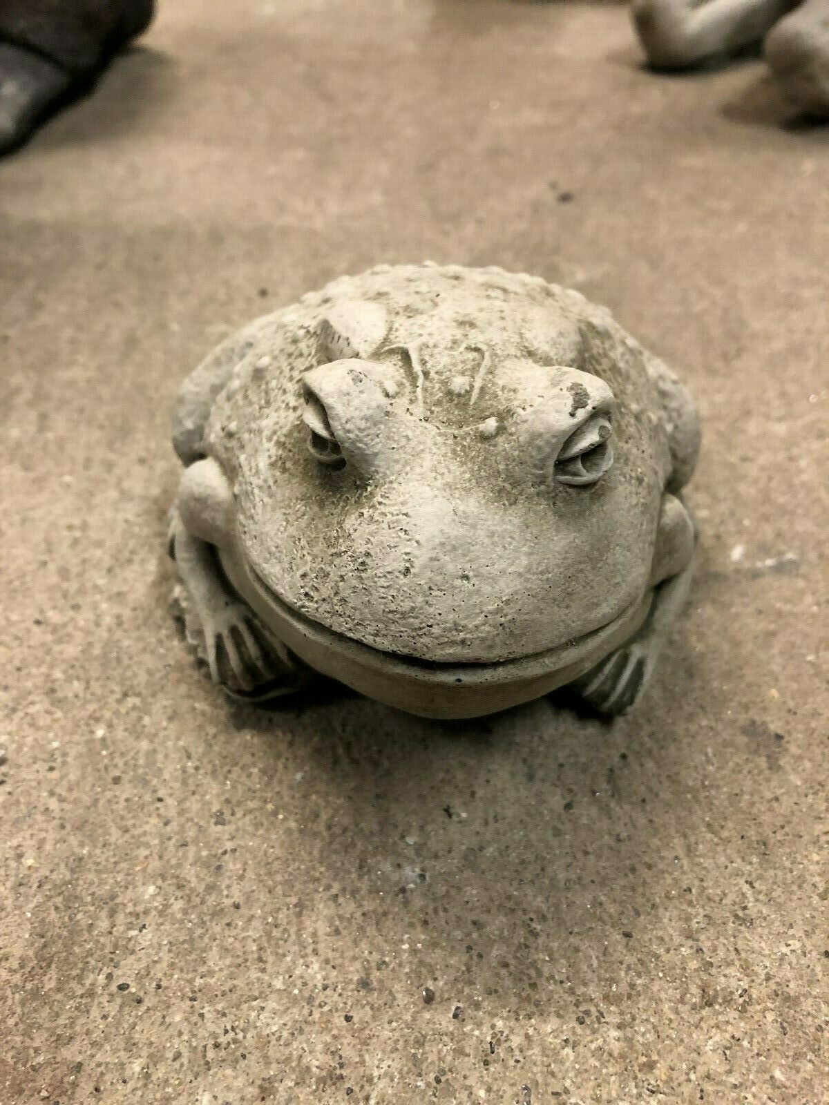 Front view of Stone Toad Ornament for Garden Enhancement, crafted from durable limestone with realistic texture for outdoor decor.