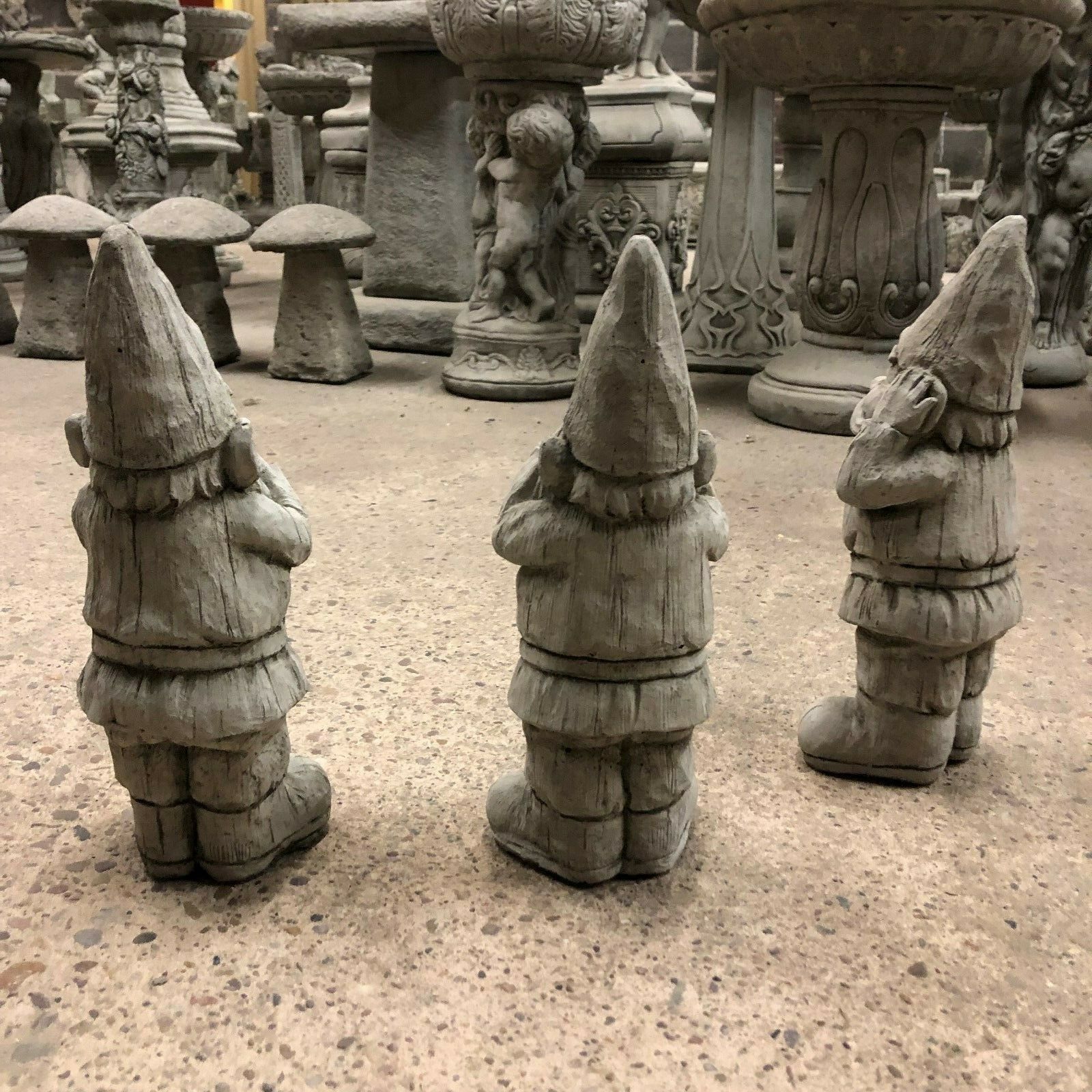 Rear view of Gnome Statues Set - Stone Hear See Speak No Evil showing textured stone finish. Durable garden ornaments for outdoor use.
