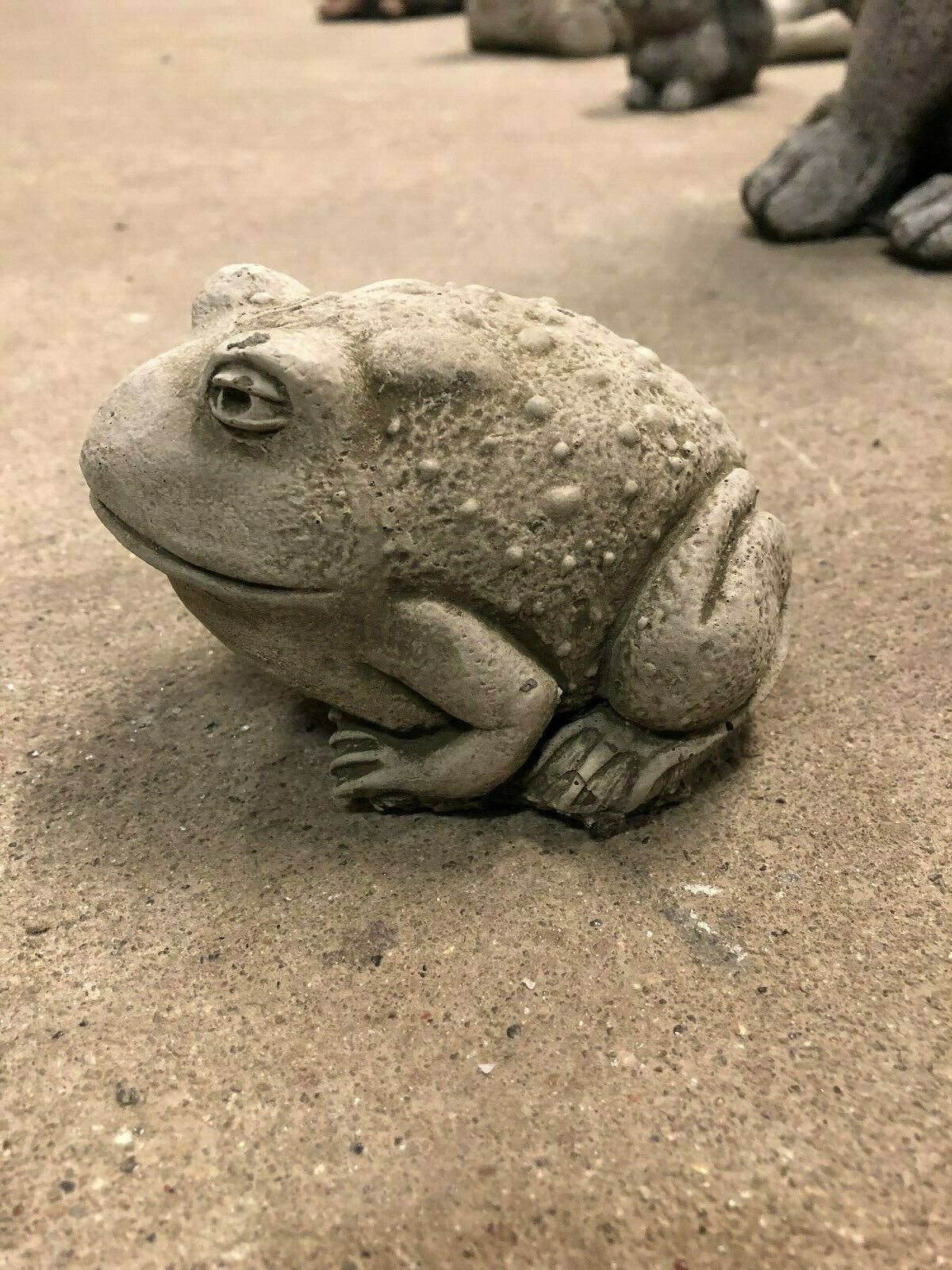 Side profile of Garden Toad Ornament-Stone Toad Feature showing detailed limbs and lifelike expression, perfect for lawn or garden sculpture.