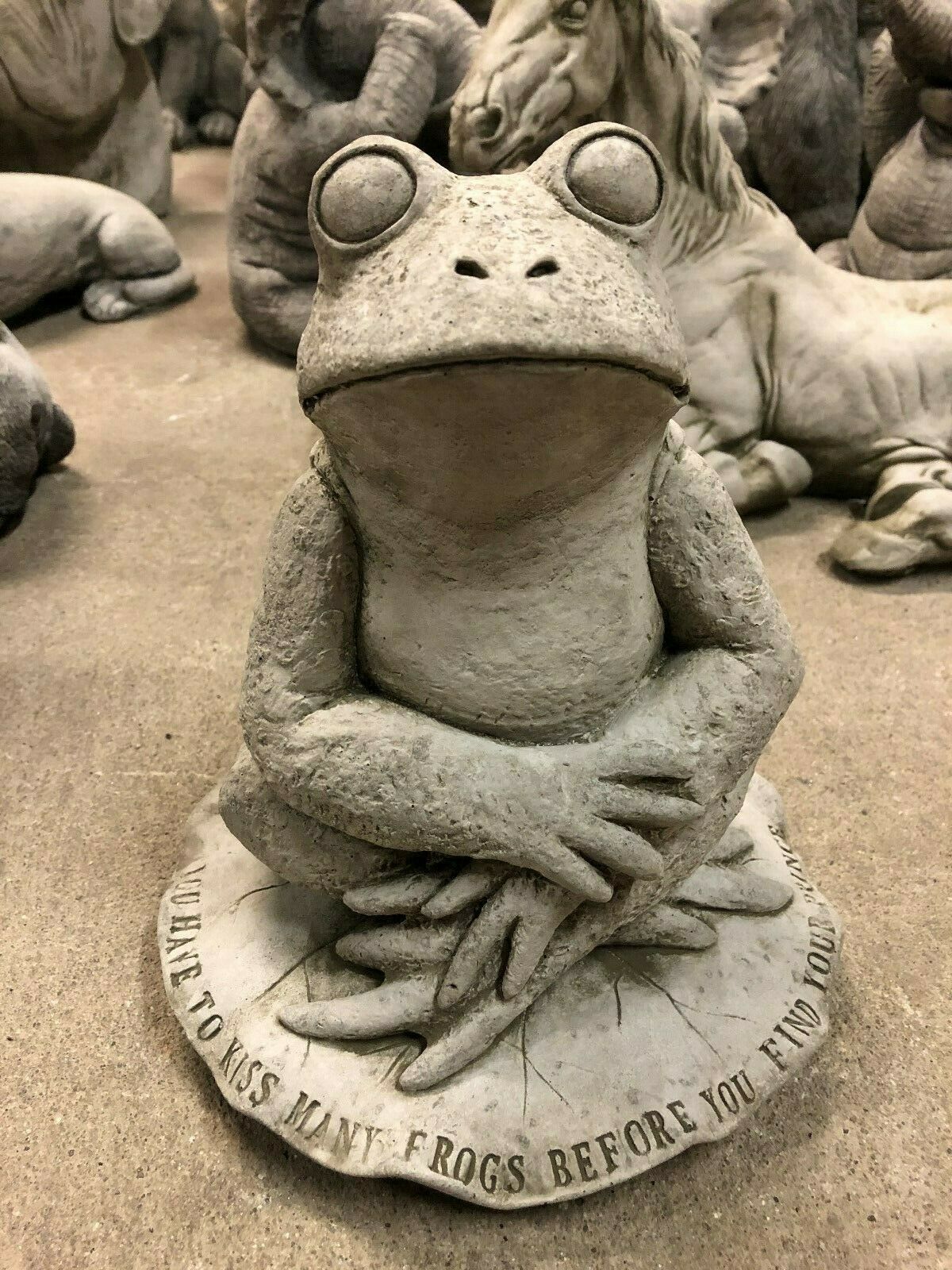 Stone Frog on Lilypad Ornament - Garden Decor | Limestone Finish. Features a whimsical frog with folded arms and engraved quote on a lilypad base.