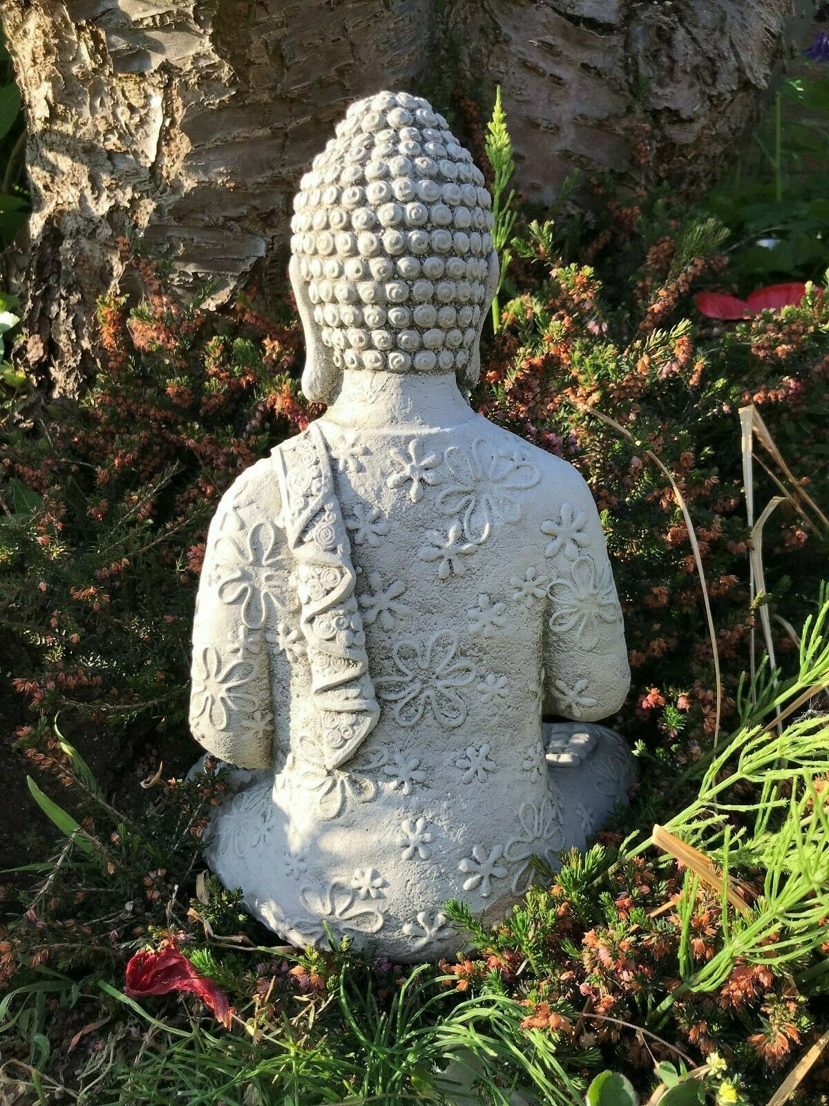 Back view of Stone Mediation Buddha Statue showcasing detailed floral patterns and durable stone texture for garden ornament use.