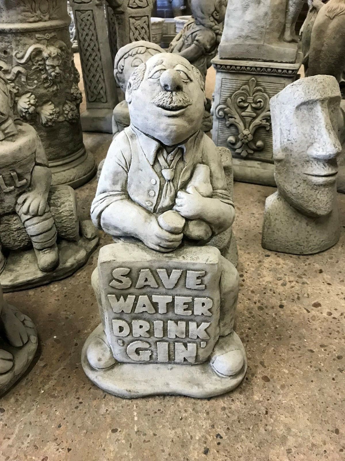 Stone Gin Man Statue with 'Save Water Drink Gin' sign, a humorous garden ornament made from solid limestone for outdoor decor.