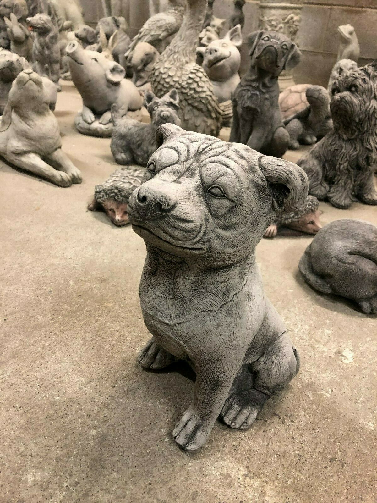 Stone Staffordshire Bull Terrier Statue for Garden Decor. Handcrafted limestone dog figure with lifelike features, perfect for home and garden styling.