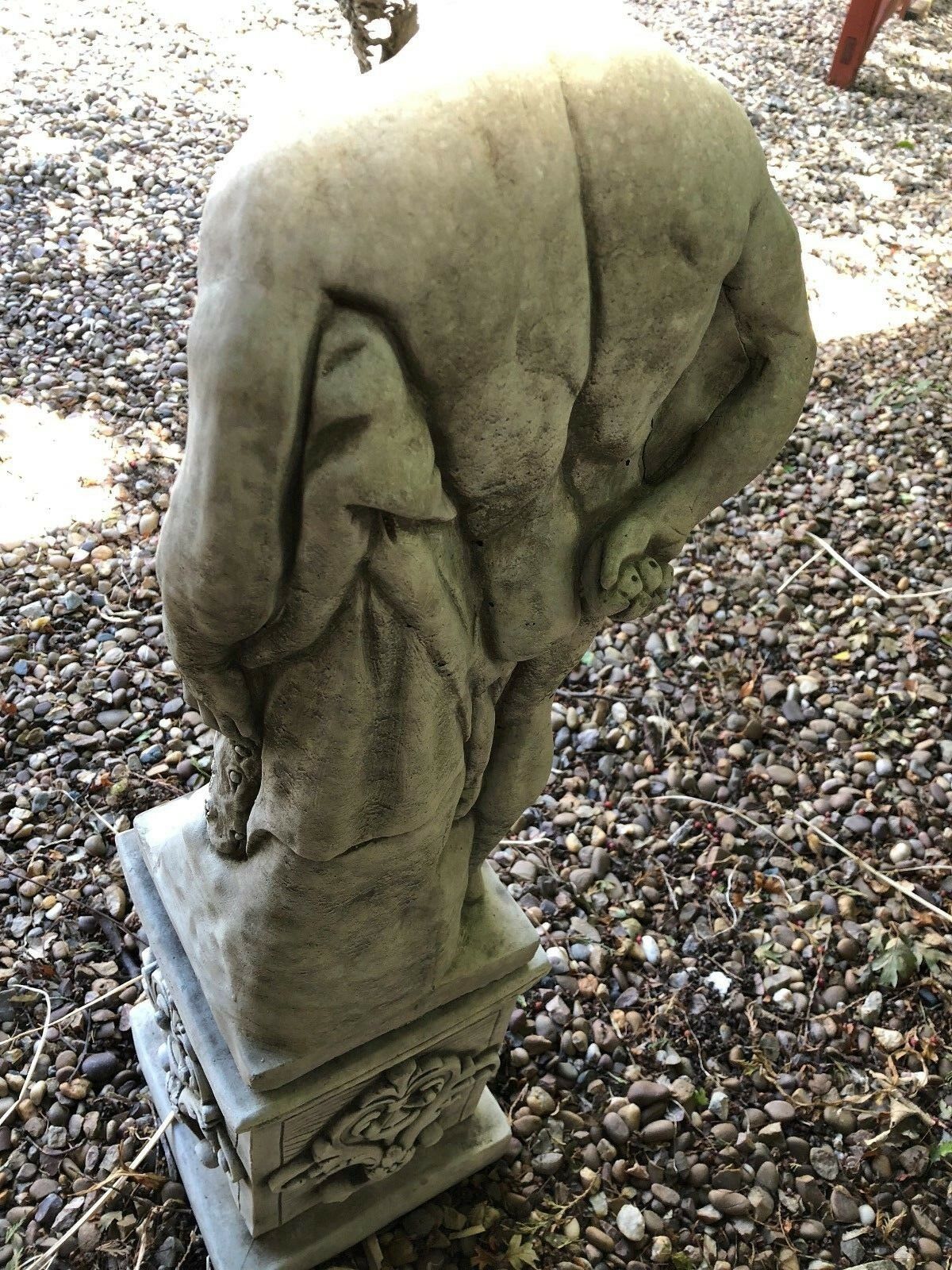 Back angle of Hercules sculpture showing muscular form and lion skin, ideal for classical garden decoration.