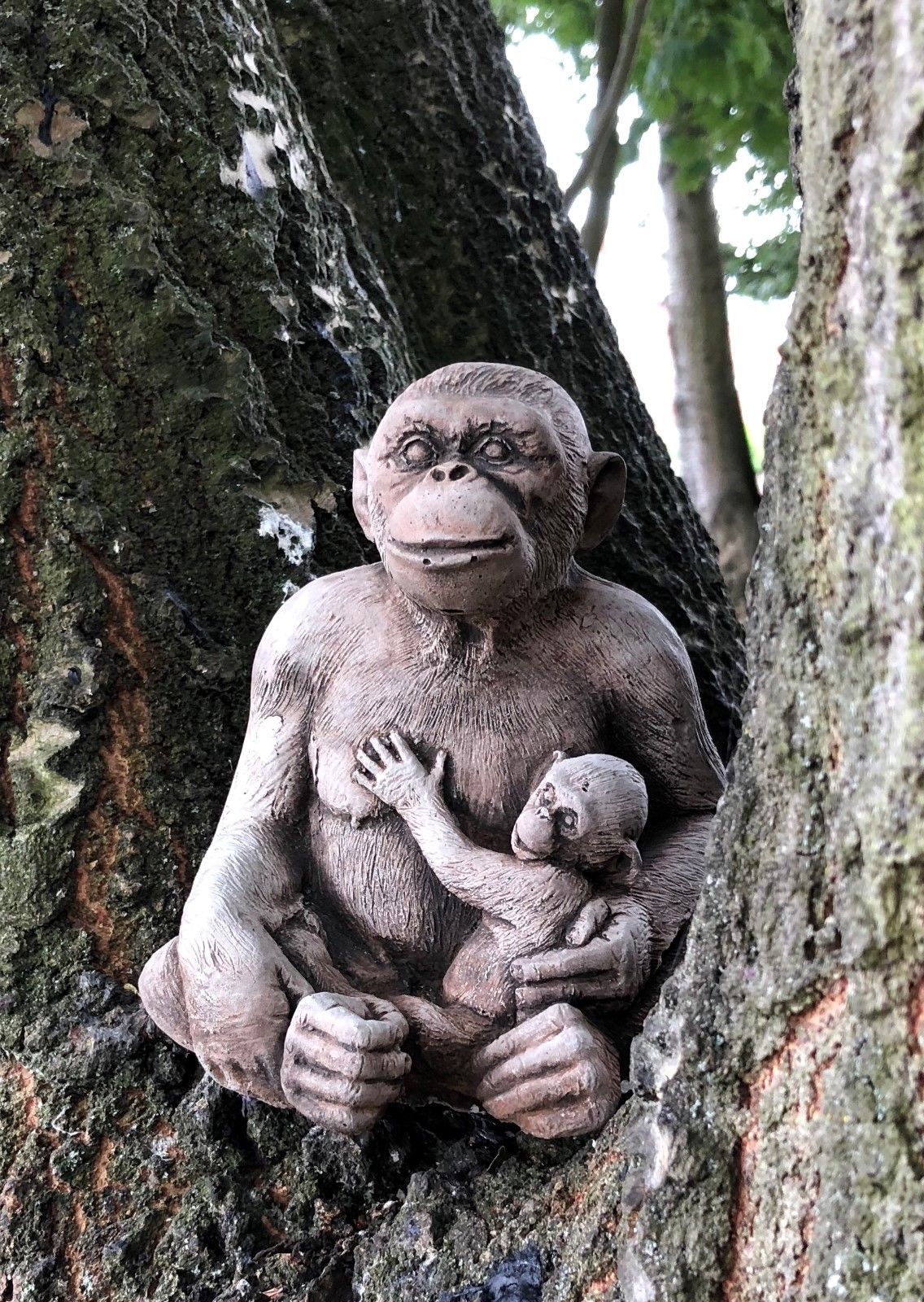 Stone Monkey Garden Ornament - Decorative Outdoor Piece featuring a mother and baby monkey nestled in a tree, ideal for garden lovers.