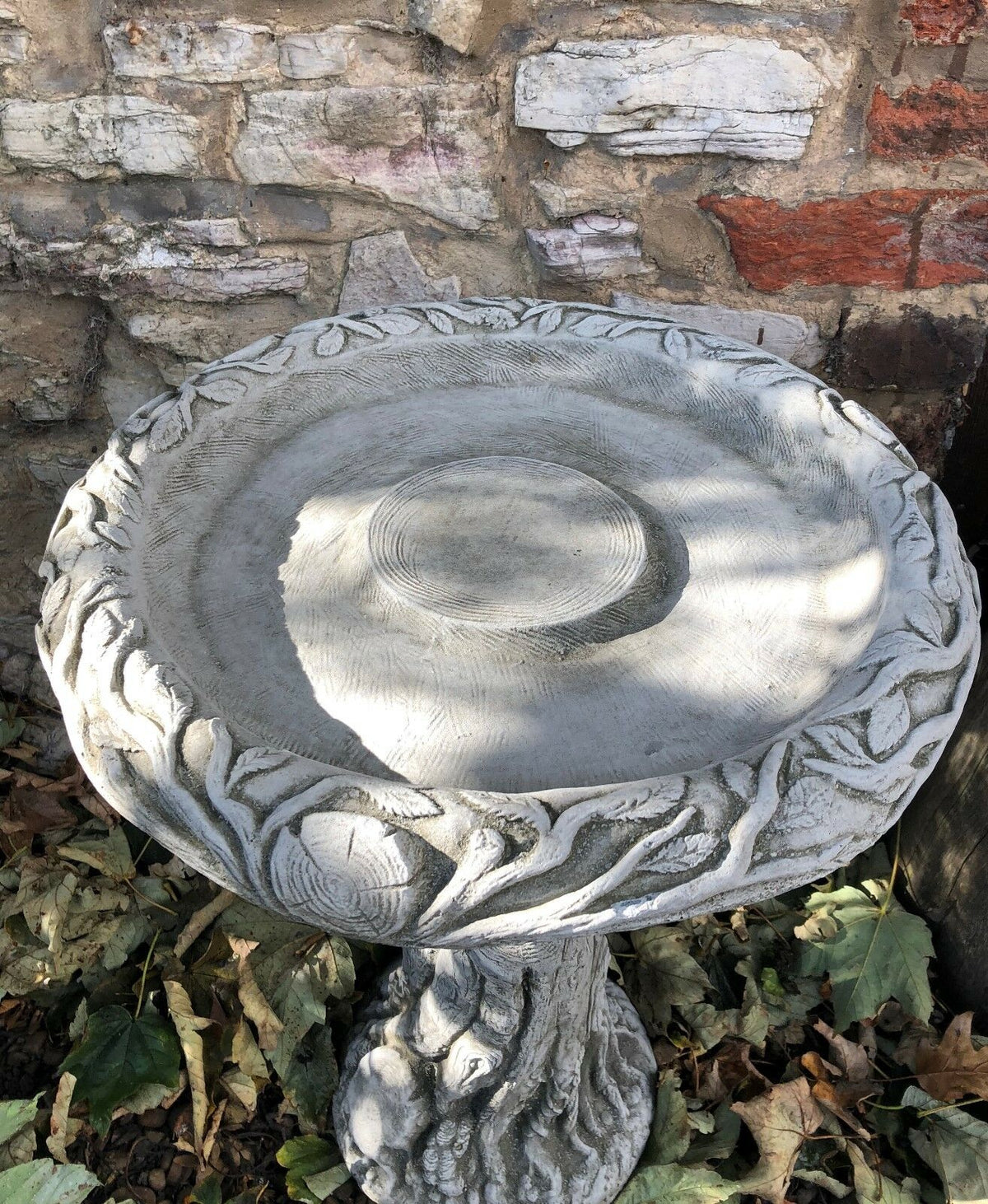 Close-up of Tree Trunk Design Bird Bath bowl, showcasing detailed wood grain patterns and stone craftsmanship.