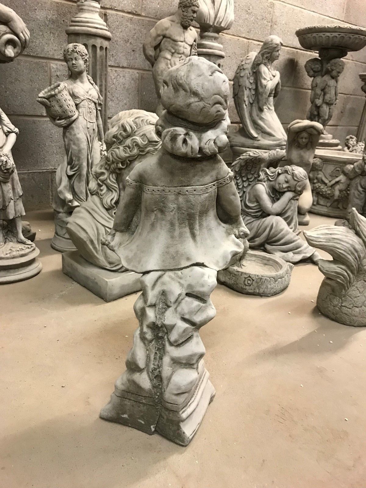 Back view of Shy Girl Garden Ornament with detailed hair and dress design, made from durable, weather-resistant stone.