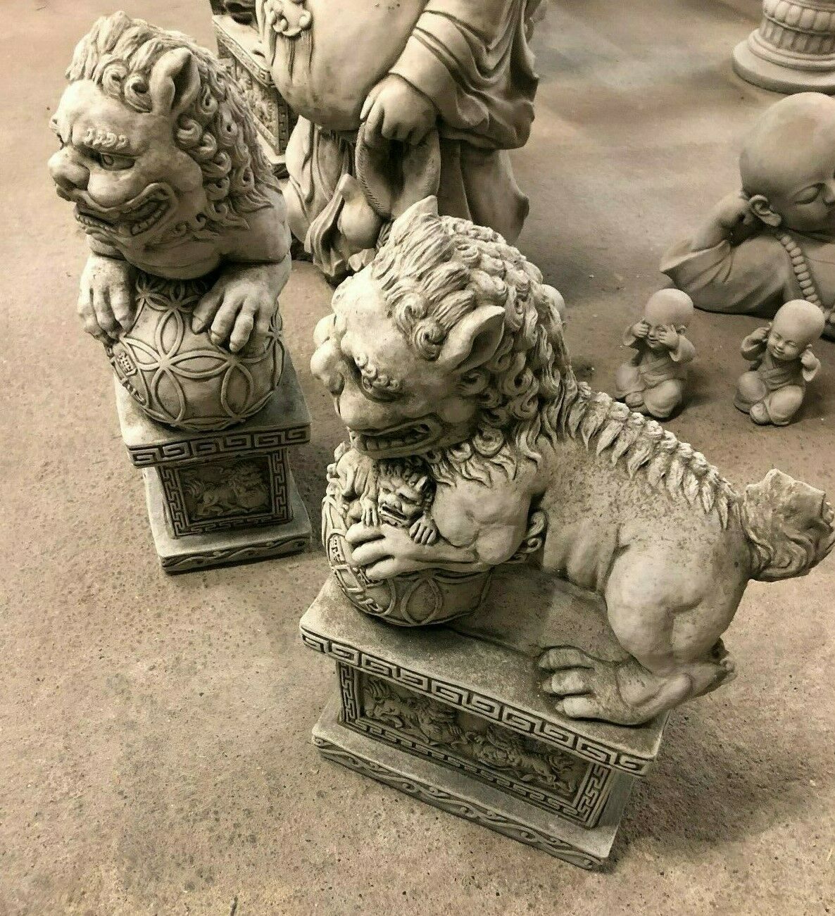 Angled view of Foo Dog Statue pair emphasizing symmetry and traditional design, perfect for flanking garden entrances.