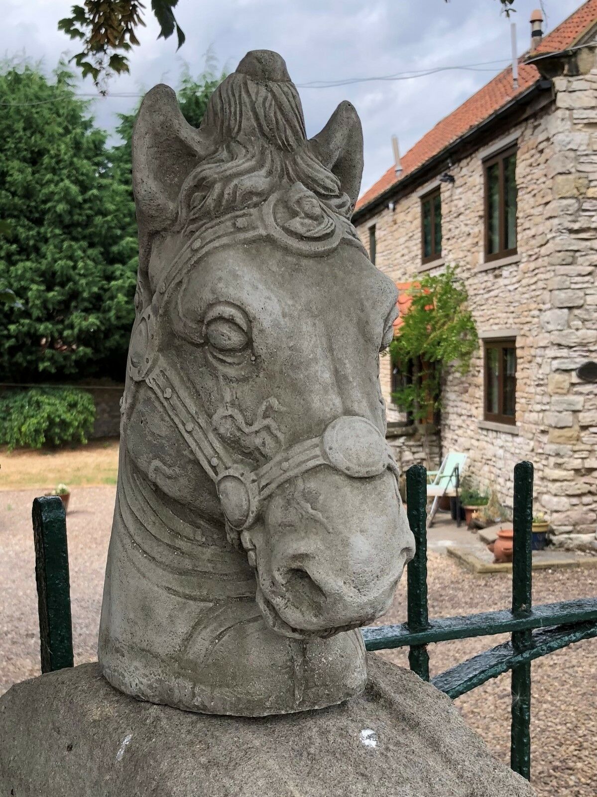Stone Horse Head Finial-Limestone Garden Decor | Made in UK. Durable stone horse head garden finial with intricate reins, suited for patios or gates.