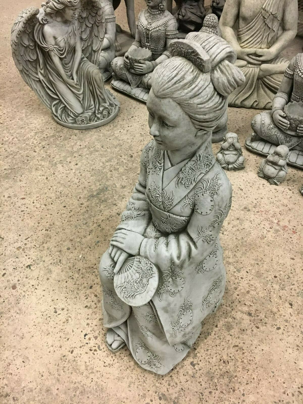 Stone Kneeling Geisha Lady Statue in detailed kimono, ideal for elegant garden decor and outdoor lawn ornamentation.