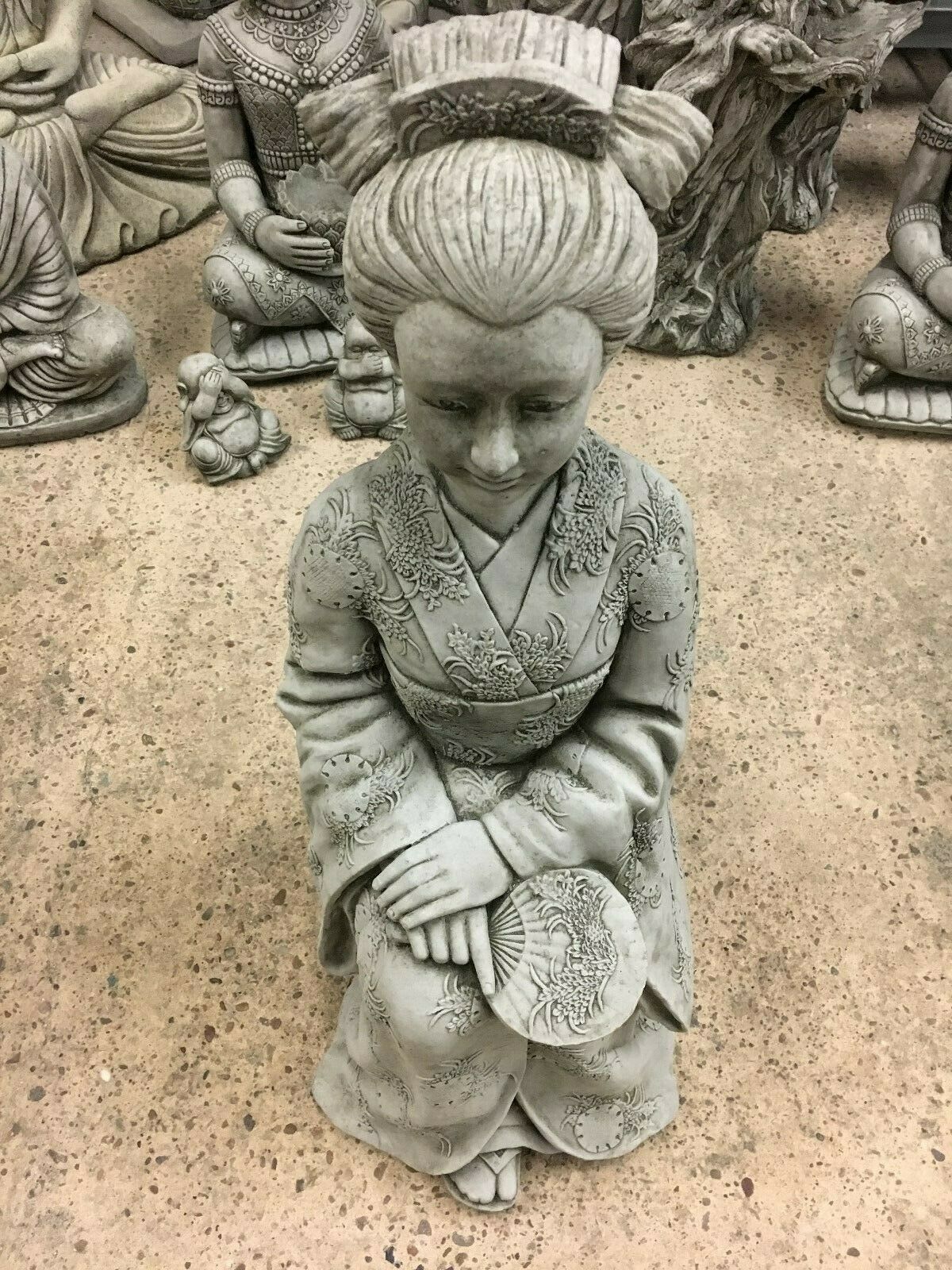 Front view of Stone Kneeling Geisha Lady Statue showcasing intricate limestone craftsmanship for home and garden sculpture decor.