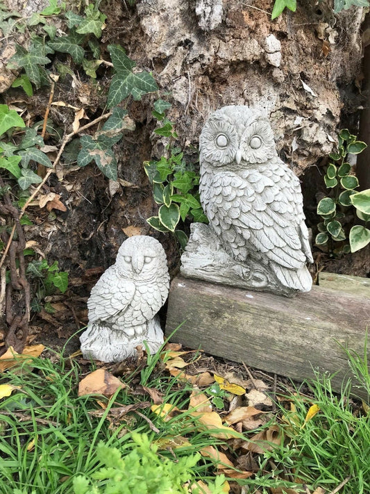 Stone owl garden ornaments featuring a mother and baby owl pair crafted from durable limestone. Ideal for outdoor garden decor with antique finish.