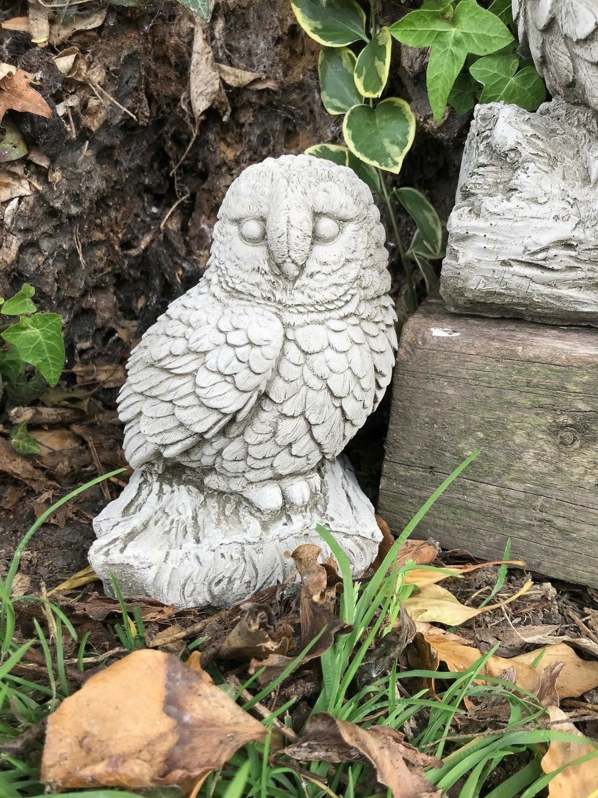 Baby owl garden ornament made from weather-resistant limestone. Complements mother owl statue for charming outdoor decor.