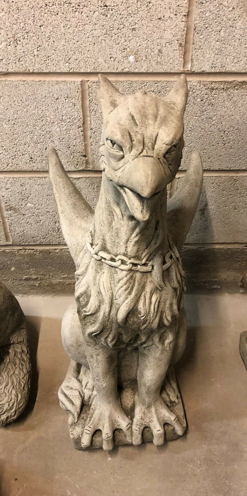 Front view of a single limestone phoenix statue with intense gaze and antique finish, ideal for lawn or porch decor.