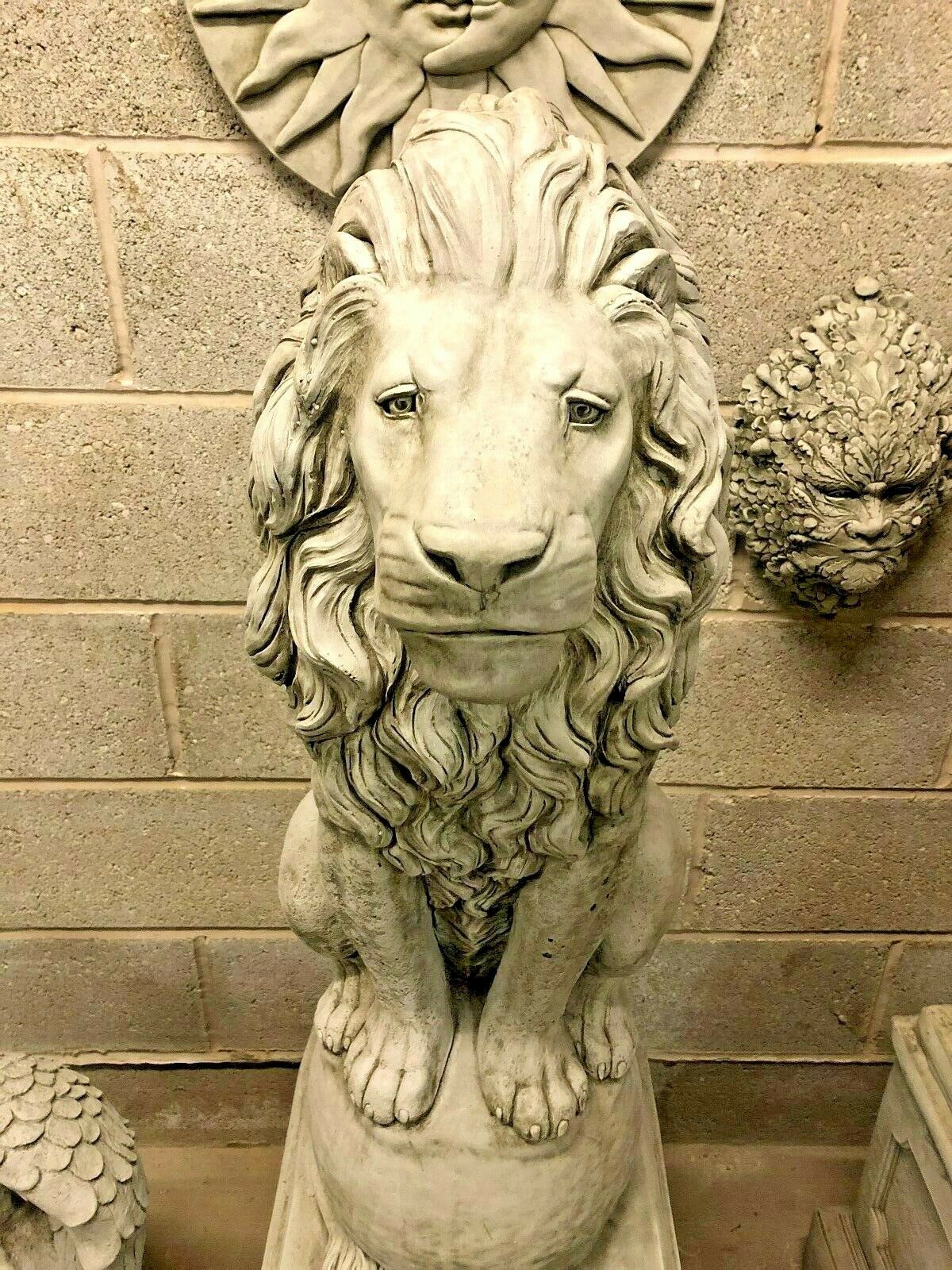 Front close-up of a lion statue with intense gaze and detailed mane, designed to be a striking centerpiece in garden landscapes.