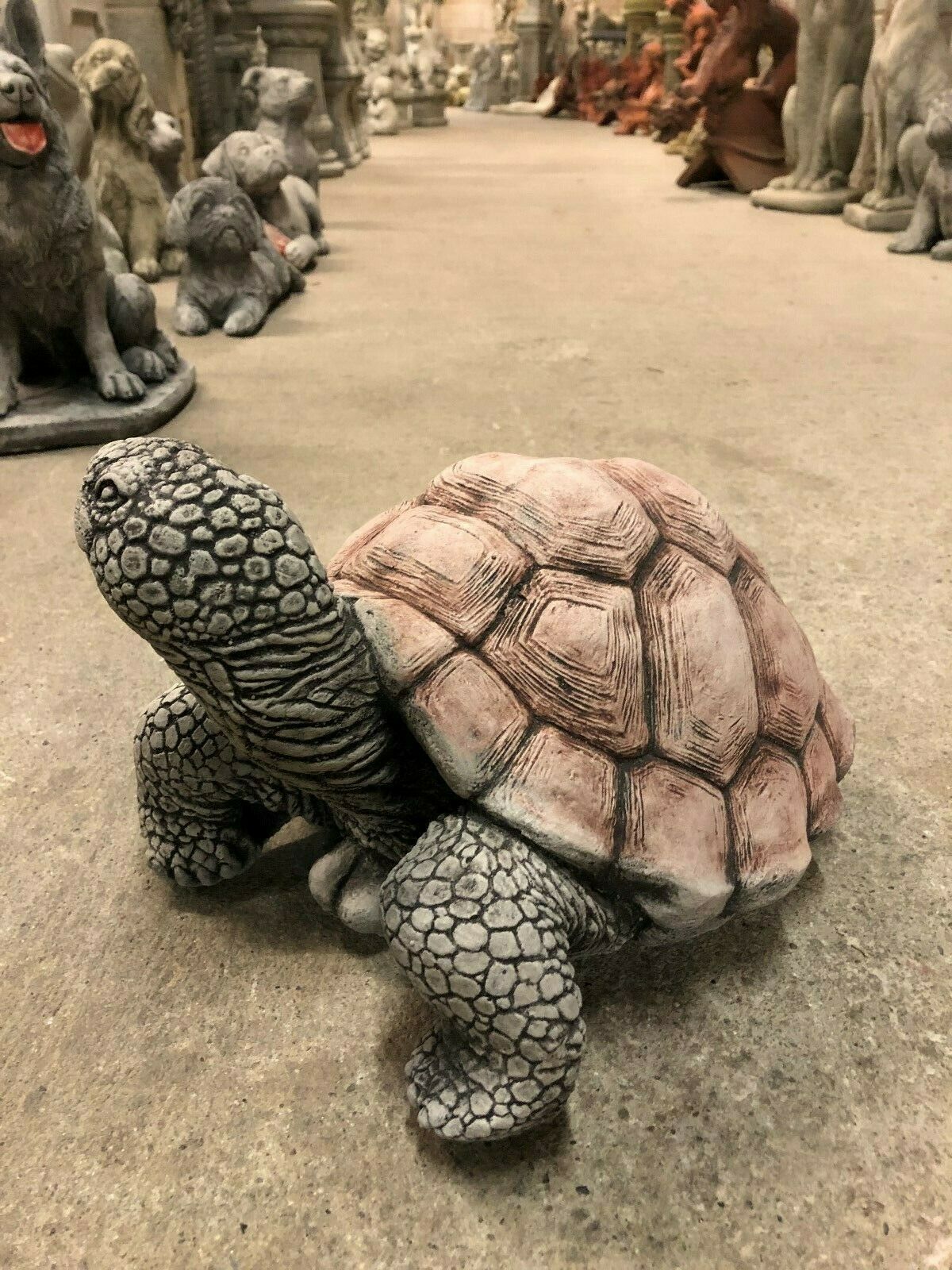 Realistic large tortoise garden statue with antique stone finish, designed for patios, lawns, or flower beds. Adds charm to outdoor spaces.