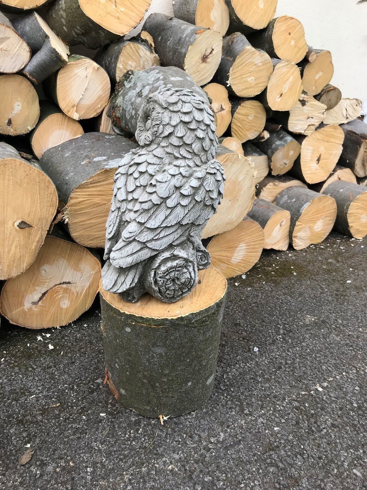 Rear view of mother owl limestone ornament showing feather detail. Weatherproof sculpture for garden or patio display.