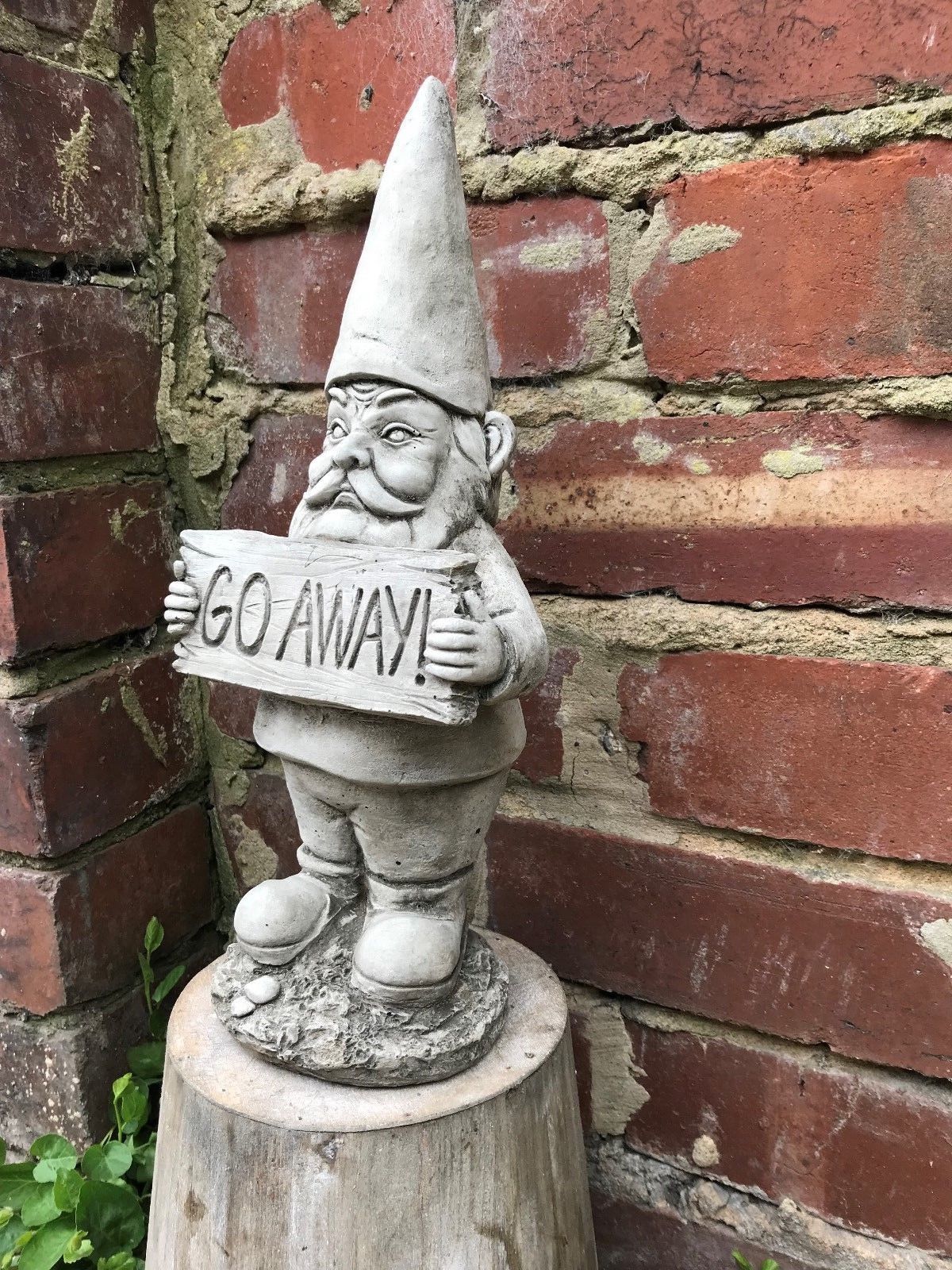 Side view of Grumpy Garden Gnome - Go Away stone decor, showing detailed facial expression and weather-resistant craftsmanship.