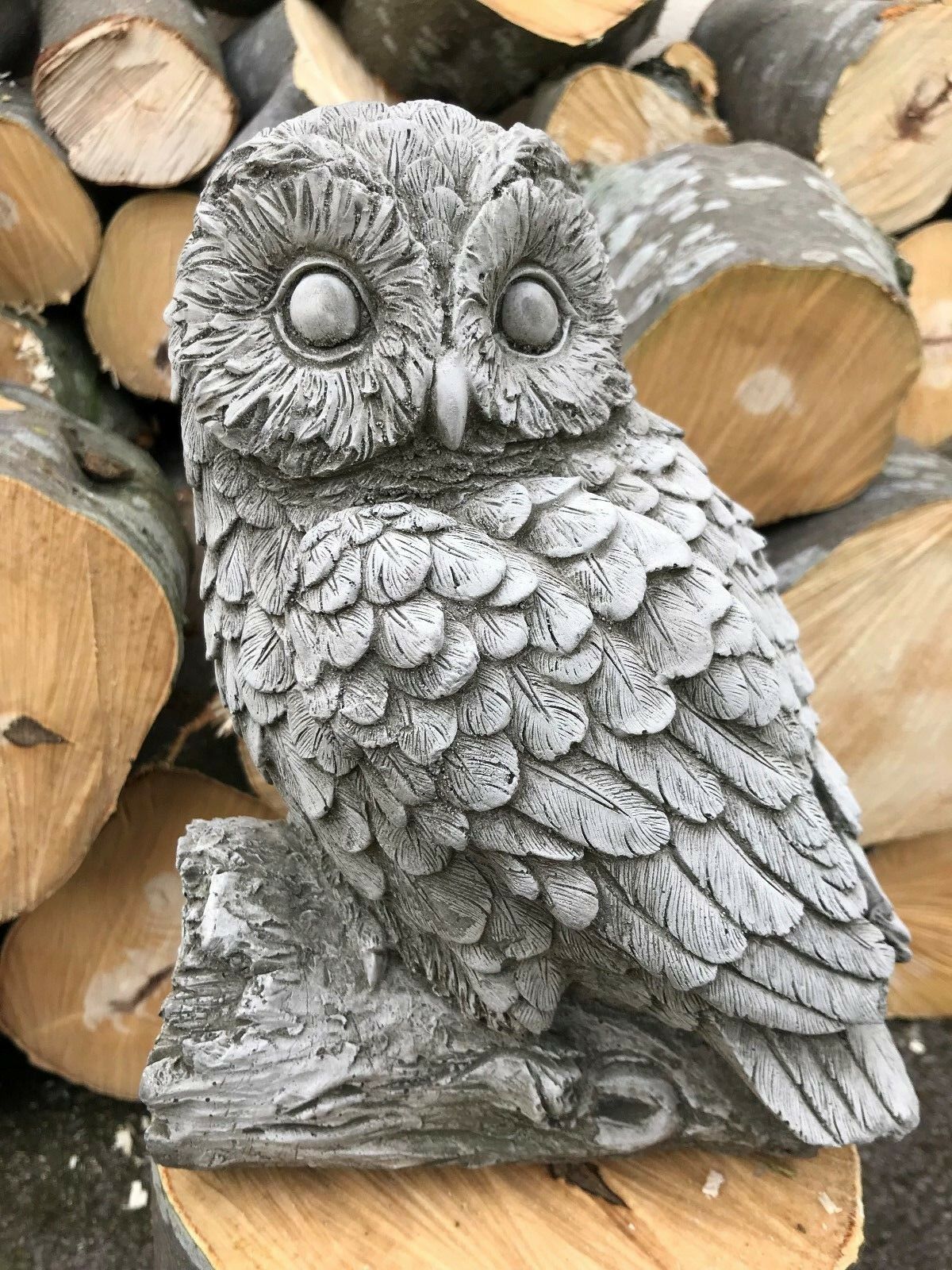 Front view of mother owl limestone ornament with lifelike eyes and feathers. Perfect for rustic garden or patio decor.