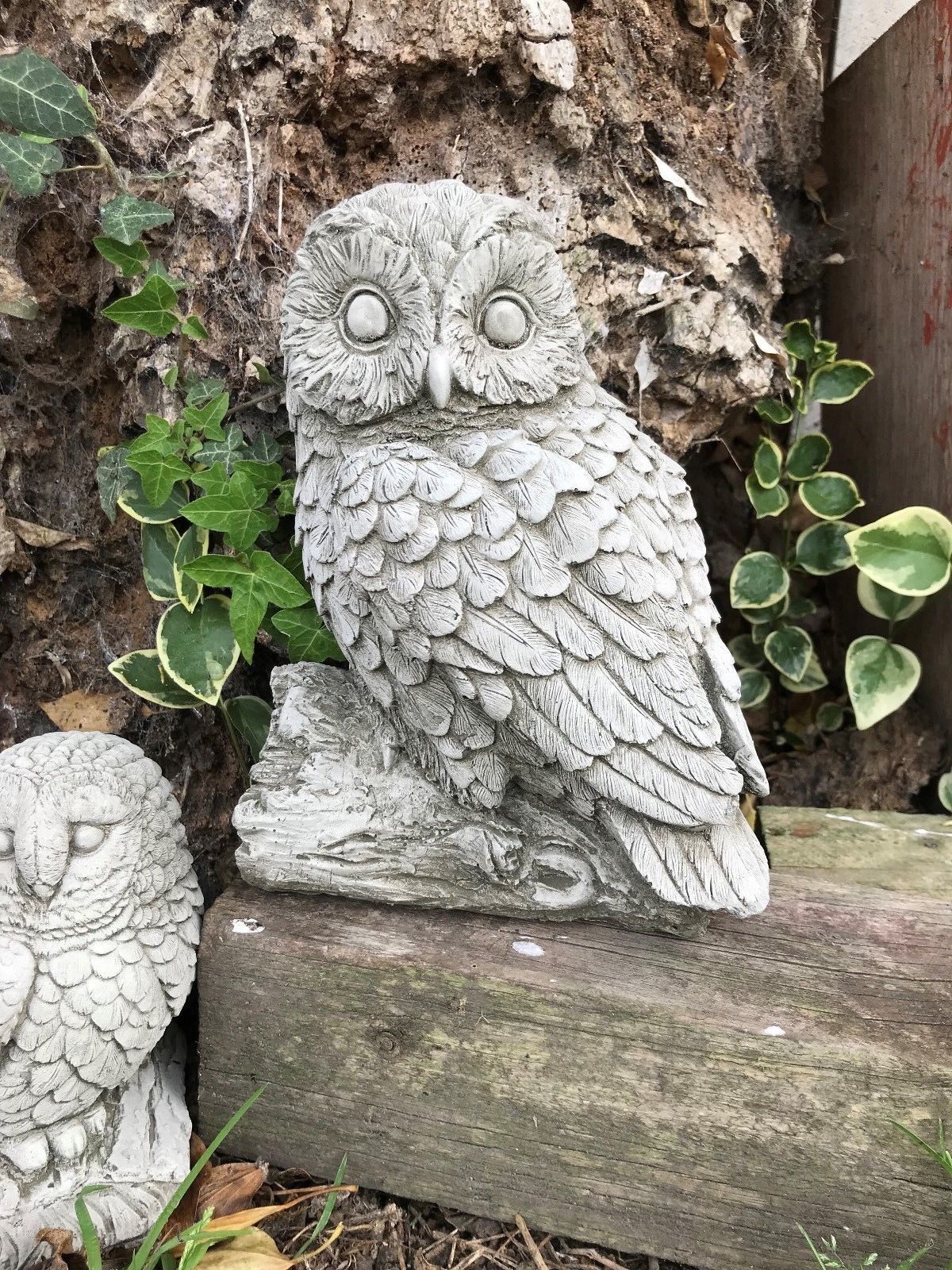 Detailed front view of mother owl limestone statue. Ideal for enhancing garden aesthetics with natural stone decor.