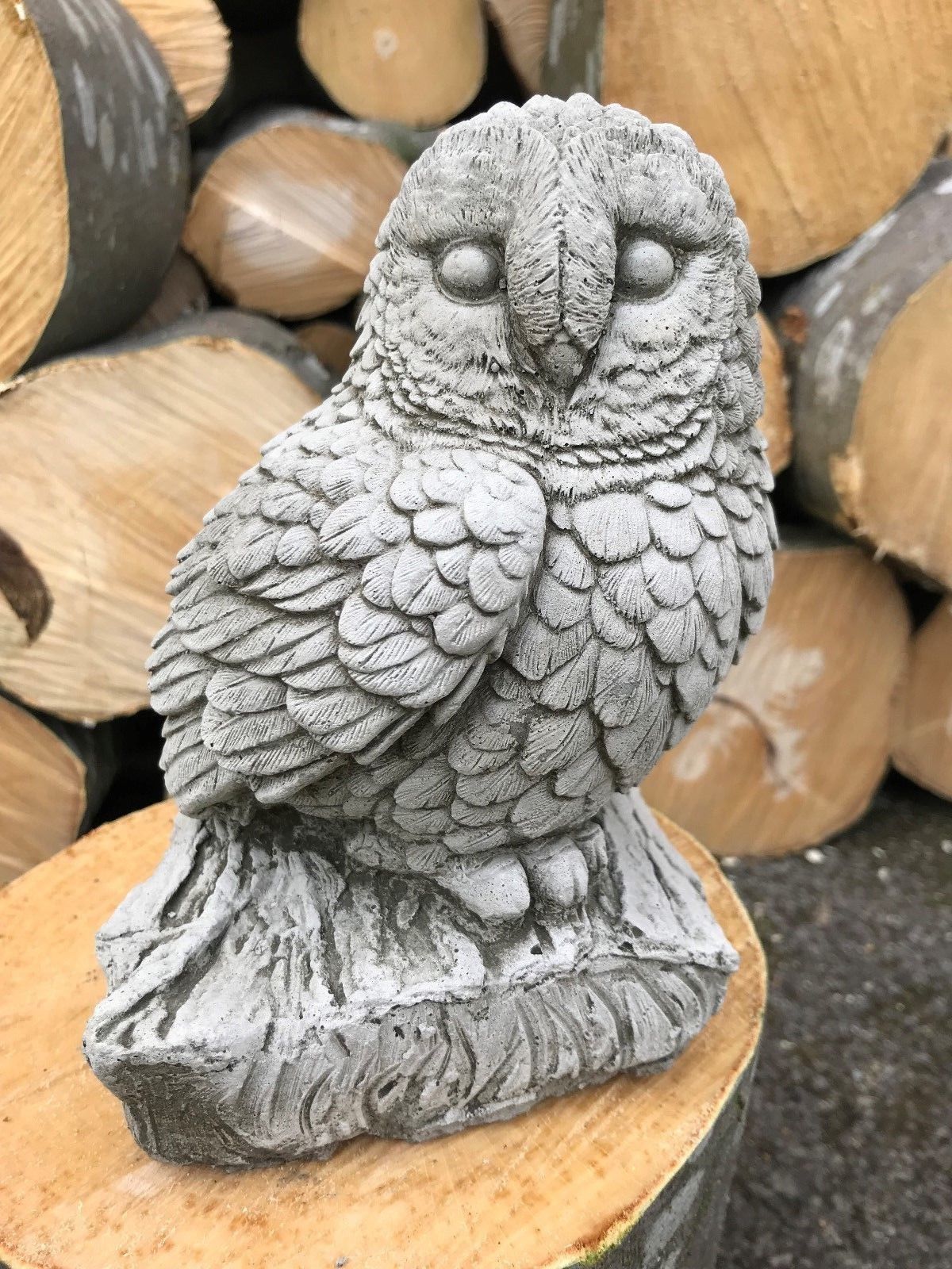 Single limestone owl sculpture on log base, part of Stone Owl Garden Ornaments - Mother & Baby. Ideal for outdoor garden decor.