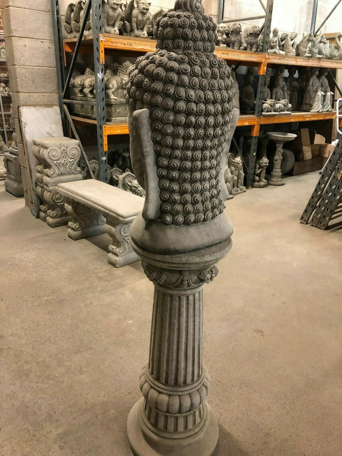 Angled rear view of Buddha Head Garden Statue showing detailed craftsmanship. Ideal for patios, flower beds, or garden platforms.